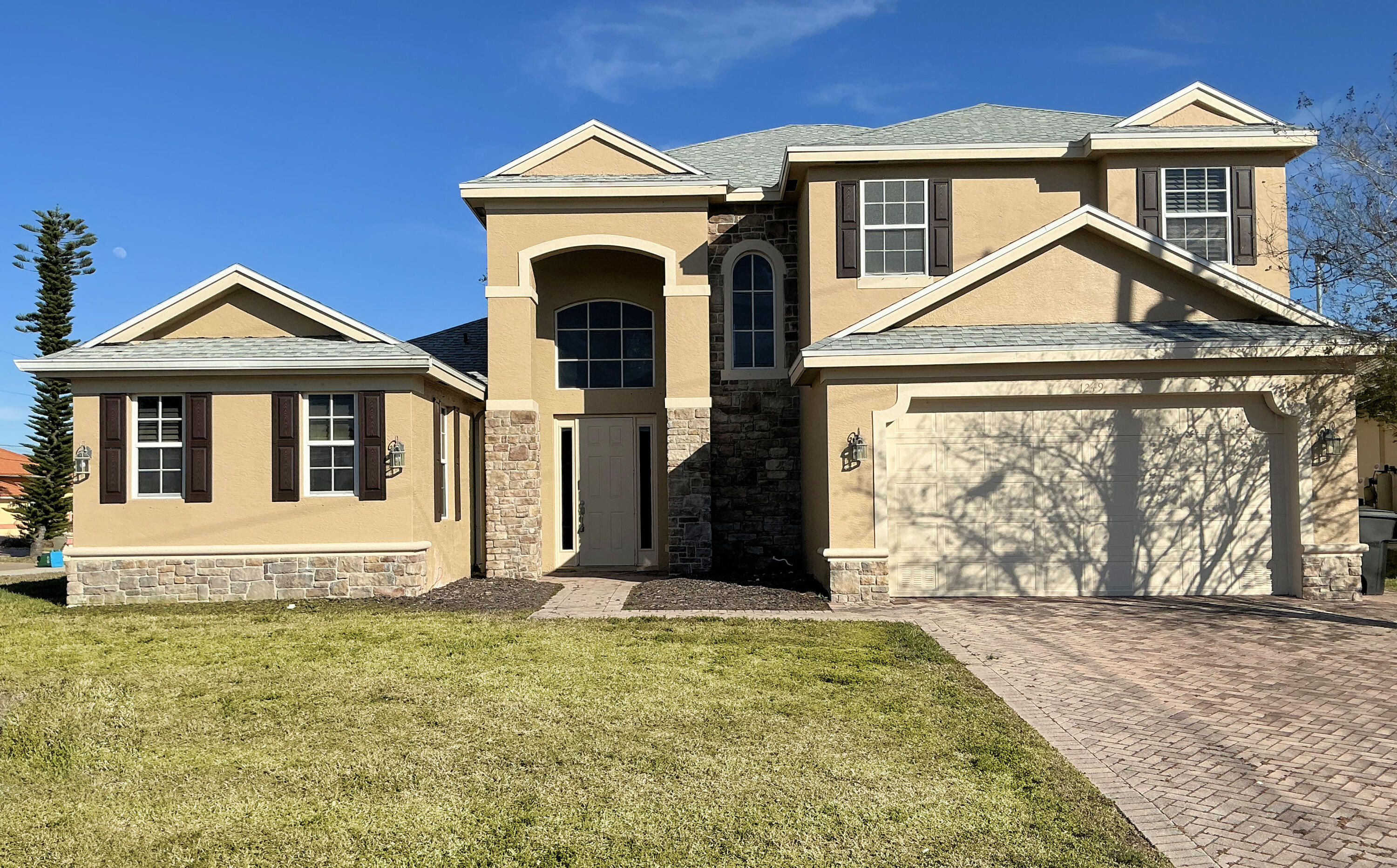 Beautiful huge two story home in north Cape Coral. Why wait to build! The home has 4 bedrooms 2 1/2 bath, den/office with a 2 car garage. Approx. 2768 sq. ft. The home features beautiful hard wood floors, tile and brand new carpet. Freshly painted! The master bedroom has his and her closets with a luxurious master bath and soaking tub with jets and a walk in shower. Open floor plan, guest bedrooms up stairs, large back yard with room for a pool.