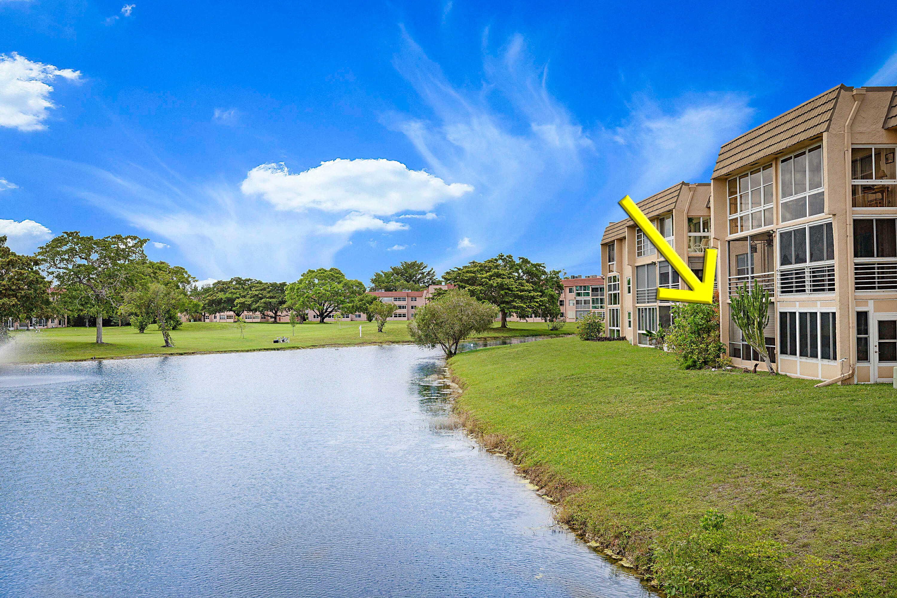 Rare opportunity to create your own vision in one of the community's most desirable lakefront locations! This spacious 2 bedroom/2 bath ground floor condo offers 1,025 SF, serene lake views, a quiet cul-de-sac-like setting, and assigned parking directly in front of the unit. The unit requires a complete renovation and is priced accordingly. Located just across the lake from the clubhouse and amenities with convenient walking-bridge access just steps from your door. Enjoy resort-style living with a complementary 9-hole golf course, 10 pools, tennis, pickle ball, fitness center, racquetball, billiards, clubhouse, and a full calendar of social activities!