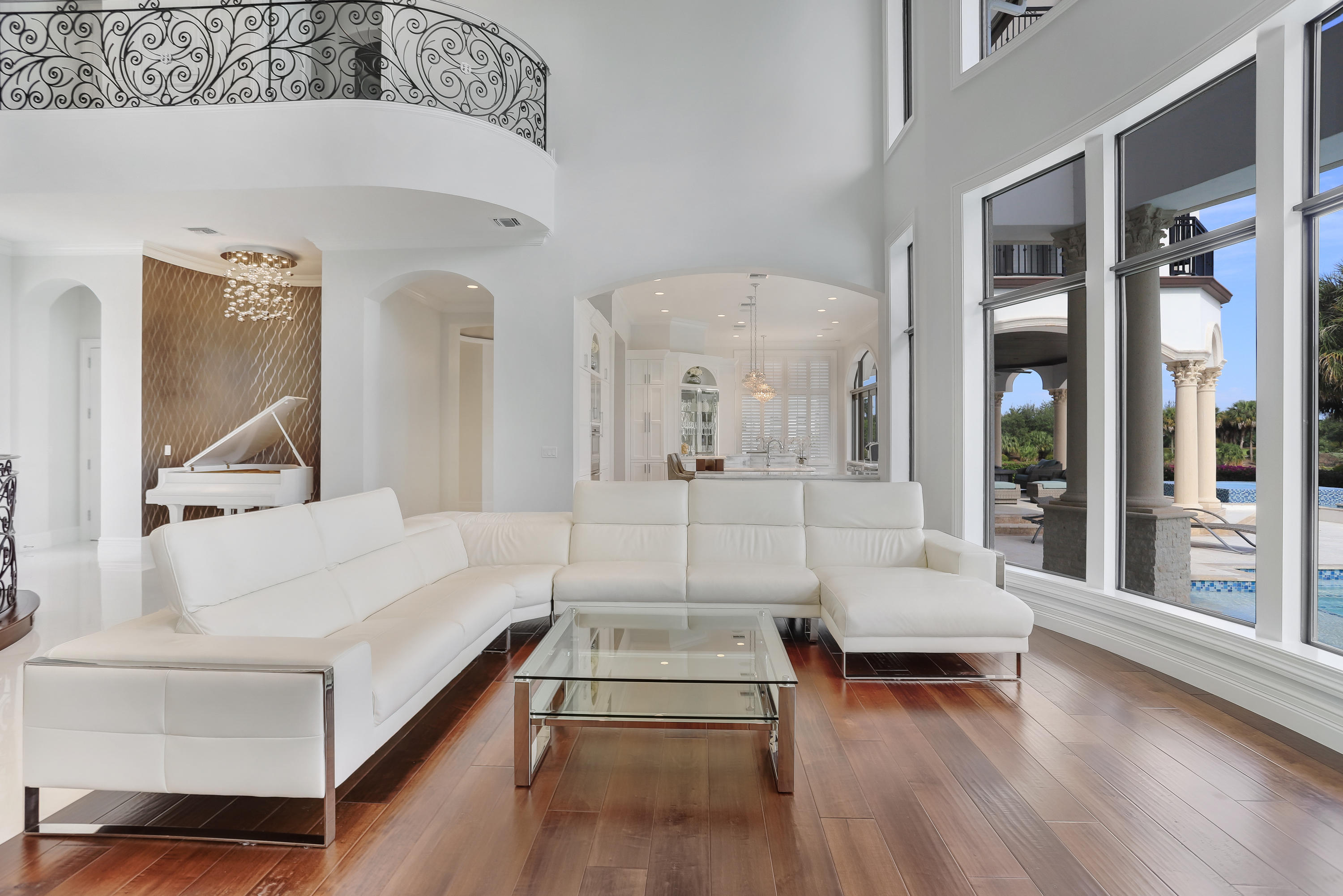 One of the finest and most dramatic residences ever built in Parkland Golf and CC.  Situated on a private cul-de-sac street with due south golf course and lake vistas.  Dual entry gates open to an expansive marble paver circular driveway, four car garage, and an extraordinary raised exterior covered entry flanked with reflecting water pools.  An interior entry foyer with glass wine wall offers glimpses into the thirty foot soaring ceilings of the great-room, with raised dining area, two story fireplace and piano area.  A full eat-in kitchen with additional counter top bar stool eating areas services the great room, in additional to the covered and open pool patio.  There are two en-suite first floor bedrooms, exercise and game rooms, and a theater.  
SEE MORE The second floor has four en-suite bedrooms including the Master bedroom suite, which includes opulent bathroom and closet areas.  One of the finest rooms in the residence is the sun filled office library retreat with its extensive glass windows and 180 degree views of the golf course and community lakes.  

The raised pool patio features an expansive heated pool with separate spa and sensational water amenities and features discussed below. 
 
*PLEASE SEE THE VIDEO LINK ON THE MAIN MLS PROPERTY PAGE
* SQUARE FOOTAGE NUMBERS PER BUILDER PLANS
  TOTAL UNDER ROOF: 9526
TOTAL LIVING/AC SQUARE FOOTAGE: 7202
BROWARD COUNTY ADJUSTED LIVING SQUARE FOOTAGE: 8196

Lot dimensions: 
125 x 165 x 215 x 165

Pool dimensions:
40 x 35 plus spa

Property details
"      6 Bedrooms
"      7.5 bathrooms
"      Dramatic exterior with transitionally contemporary interior   
"      Due south cul-de-sac location overlooking golf-course and water vistas
Includes Golf Equity membership
- Gated property with advanced security technology outside and inside
"      Dual Metal entry gates and fully fenced yard
"      Expansive Marble paver circular driveway
"      MODERN White marble and rich hardwood floors throughout 
"      Impact windows throughout
"      Raised multi-column front entry with reflecting water pools and fountains
"      Wine display wall in the entry foyer
"       Soaring 30 foot great room ceilings
"      raised dining area with rich hardwood floors accented with custom wrought iron railings
"      two story great-room bio-fuel fireplace in addition to mounted television 
"      recessed piano area off great room
"      Stunning Modern contemporary kitchen cabinetry with ultra-select marble surfaces
"      Induction cooktop
"      Eat in kitchen
"      Breakfast area with additional great-room eating areas 
"       Wolf oven/steam-oven/microwave 
"      Dual Sub-zero refrigerators with f four freezer drawers.
"      Extraordinary crystal light fixtures throughout stay and convey
"      Hand Crafted decorative wrought-iron staircase railing and second floor open areas
"      Elevator
"      Media Room
"      Exercise room
"      Game room
"       Four car garage
"      Two en-suite first floor bedrooms
"      Four en-suite bedrooms including fabulous Master Suite 
"      Master Bedroom and SW bedroom feature open balconies
"      180 degree vista Master bedroom office with extensive windows overlooking golf course and lake views
"      Master bath, steeping bath tub, white marble floors and custom vanities
"      Separate water closet and bidet
"      Marble shower with frameless door and dual shower heads
"      Spacious custom fitted master closet 
"      Spiral staircase from master suite to third floor covered entertainment deck with 360 degree views of the community and south Florida sunsets
"      Extensive use of custom millwork, crown molding and plantation shutters throughout 
"      Raised Marble pool paver patio deck
"      Oversized pool with spillover- spa, sun-shelfs, water deck jets, bubblers, accent lighting and fire bowls
"      Exterior Barbeque entertainment area off the kitchen 
"      Marble walkway accessibility from front to back on the east and west sides of the property 
"      Four Air conditioning systems
"      PENTAIR exterior lighting system 
- Control for full house sound system, inside and out
- Front water features
- Full home clean water filtration system for drinking, showering, taps.
- Over sized propane tanks 
-Irrigation - connected to weather system for increased water efficiency, controlled by app.
- Hidden interior wall sound speakers
- Home is fully sound proof. every room & all floors are sound insulated.
- One of the Largest and most advanced pool in Parkland G&CC
"      West side raised fountain  with cast stone columns, covered trellis and  natural Bougainvillea landscaping 
"      Multiple exterior security cameras 
"      Buried propane tank on south-side of the house
"      Play rear areas side-yards with soft Bermuda grass
"      See listing office for further details, Parkland Golf and Country Club and Property Owners association information 
"      24 hour prior showing notification to listing agents 
 
 'A' Rated Public schools