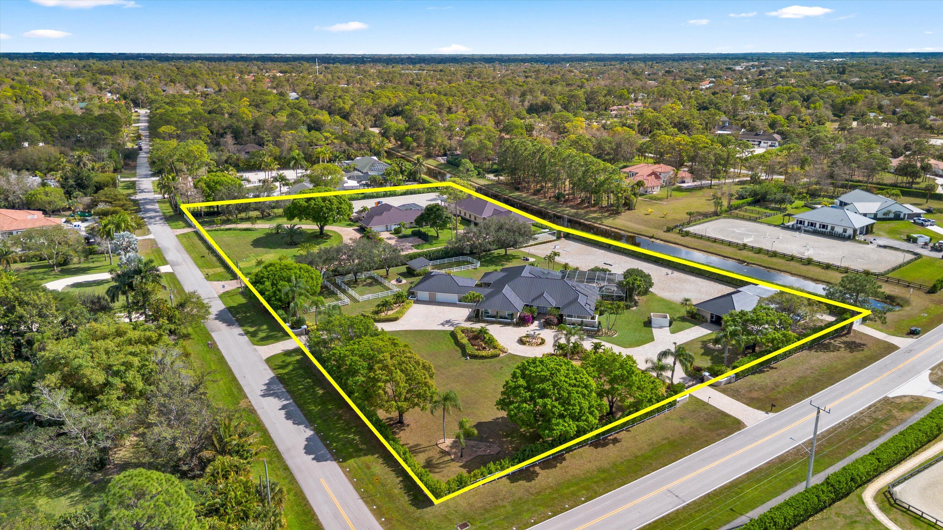 A rare opportunity to own the ultimate equestrian estate on 4.74 acres across two combined parcels. This exceptional property features two residences—a 4-bedroom, 3-bath home and a 3-bedroom, 3-bath home—both offering open floor plans ideal for modern living. Designed for serious equestrians, the estate includes a 12-stall barn, two arenas, a dressage mirror, and six paddocks. Outdoor living shines with two pools and a summer kitchen, perfect for relaxing or entertaining. An extraordinary compound blending luxury, functionality, and top-tier equestrian amenities.
