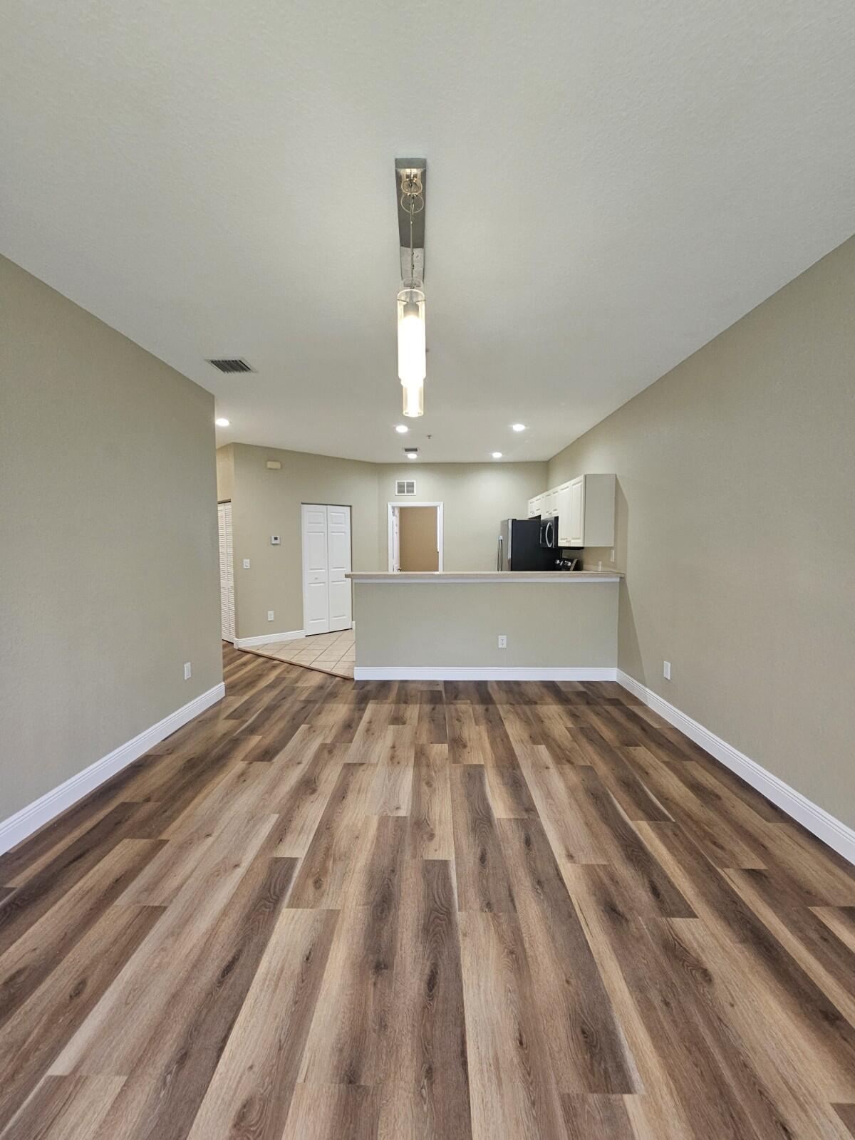 Beautifully renovated and freshly painted 3-bedroom, 2-bath second floor condo in a gated, investor-friendly community! This move-in-ready unit features newer kitchen appliances, updated kitchen and bathrooms, and brand-new laminate flooring throughout the living areas and bedrooms. The spacious primary suite offers a walk-in closet and private en-suite bathroom. Enjoy resort-style amenities, including scenic lakes, fountains, a swimming pool, tennis courts, clubhouse, and fitness center. Conveniently located in Riviera Beach with easy access to major highways, shopping, dining, schools, and more. Whether you're looking for a place to call home or a smart investment, this property offers the best of both worlds. Owner-occupants will love the move-in-ready condition and convenient location while investors will appreciate the investor-friendly community with immediate rental eligibility and excellent income potential. Don't miss this incredible opportunity!