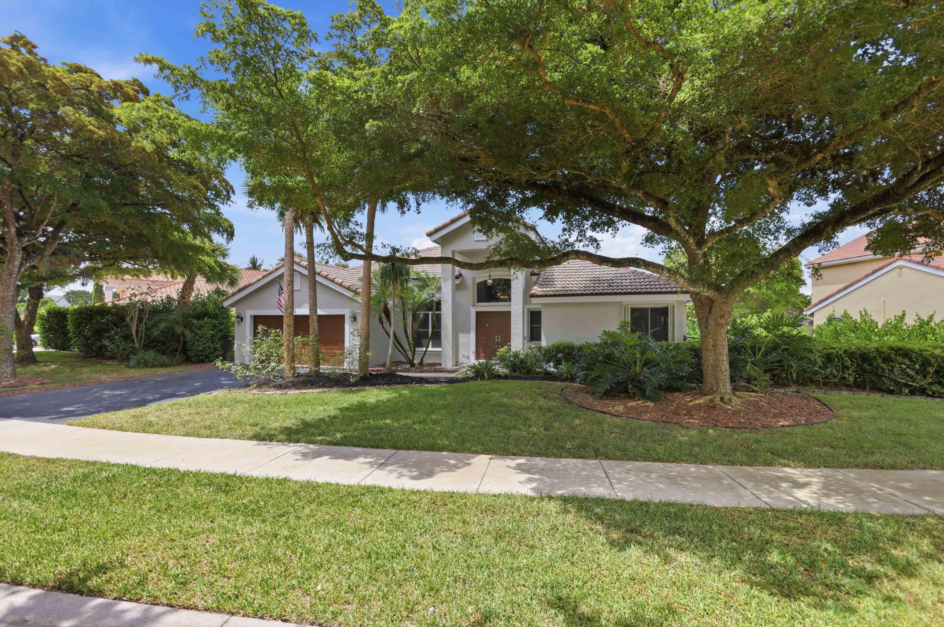 Updated 4 / 2.5 lakefront pool home in the intimate guard-gated Whittier Oaks offers 2,171 sq ft of comfortable living space on a spacious lot. Recently remodeled kitchen with vaulted ceilings and open flow, Waterproof LVP flooring throughout,  and an updated primary bathroom, perfect for everyday living and entertaining. Outside features a remodeled pool with lake views, outdoor kitchen, and is fully fenced- ideal for South Florida relaxation. Additional peace of mind comes from a 10-year-old roof. Whittier Oaks boasts low HOA fees that include lawn maintenance and gate service. The community is conveniently located next to Terramar Park with easy access to the Sawgrass Expressway. Private walkway to park, kids can ride bikes. Perfect home + Great community + Great Price = Hurry! see attached addendums for all offers 5 business day inspection