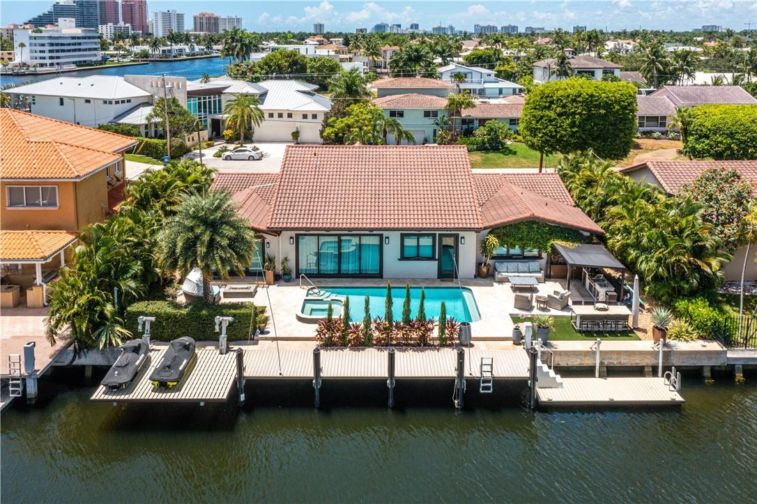 Impeccably Redesigned in 2020. Boaters Dream Home on Cul-de-sac w/ 100 ft. of water frontage. Concrete Dock w/ power pedestal and Jet Skies lift. Located on wide canal one lot from point. Quick & Easy Ocean Access. Fabulous views of the intracoastal and A+ Bayview School District. Expansive floor plan, 2 primary suites and Impressive & Spacious Gourmet Kitchen w/ Thermador Luxury Appliances. Beautiful Primary Suite overlooking waterway w/ Spa-like bathroom. Hurricane Impact Windows & doors throughout. Conveniently located within five minutes to Fort Lauderdale Beach and 10 minutes to Lauderdale by the Sea Beach. Minutes to Fabulous Restaurants and Entertainment.