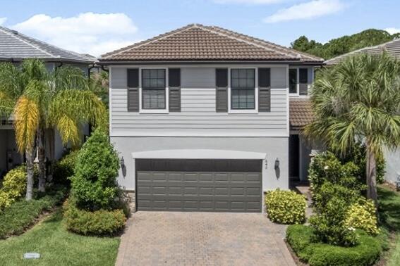 Located in the desirable Veranda Gardens community, this beautifully maintained 4 bedroom, 2.5 bath home offers 2,445 square feet of stylish and functional living space close to I 95, the Turnpike, shopping, and dining. The open-concept layout features upgraded finishes, abundant natural light, and a spacious kitchen with quartz countertops, shaker style cabinetry, decorative backsplash, and a large island overlooking the main living area. Upstairs includes a versatile loft, generously sized bedrooms, and a convenient laundry room. The backyard offers a ultra private retreat ideal for relaxing or entertaining. Built in 2020 with impact windows and doors, residents also enjoy resort-style amenities including a pool, fitness center, tennis, pickleball, and more.