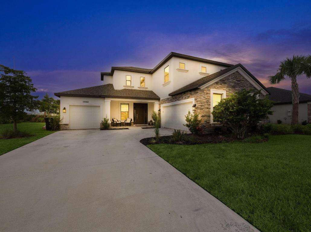 Welcome to luxury living at its finest in the highly sought-after community in Tradition! This extraordinary 5-bedroom, 4.5-bathroom estate home is a masterpiece of design and craftsmanship, boasting an array of premium upgrades and thoughtful features that create an unparalleled living experience. Upon entering, you are greeted by an expansive open-concept floor plan that immediately conveys both grandeur and warmth. High ceilings and large windows allow for abundant natural light, enhancing the home's sense of space and airiness. The thoughtfully designed layout is perfect for both intimate family living and grand-scale entertaining. The home is pool and outdoor kitchen ready with plumbing, electric, and gas already installed. The luxury master suite serves as a private retreat, offering tranquility and sophistication. Spacious and inviting, the bedroom leads to a spa-like master bath with elegant finishes, including dual vanities, a large walk-in shower with custom tile work, and a freestanding soaking tub that promises relaxation at the end of a long day. The walk-in closet provides ample space.

For movie lovers and entertainment enthusiasts alike, the media room offers the ultimate home entertainment space. Whether it's a cozy movie night, game day with friends, or extra office space, this room is equipped to handle it all. Its spacious design ensures comfort and luxury, making it an ideal space for relaxation and entertainment.

The additional bedrooms are spacious and designed with comfort in mind, each offering plenty of closet space and access to beautifully appointed bathrooms. The 4.5 bathrooms are elegantly designed with high-end finishes, providing functionality without sacrificing style.

No detail has been overlooked in this home, from the modern high-end finishes such as trayed ceilings, designer light fixtures, and wood style tile flooring throughout the main living areas. Additional upgrades include a three-car garage, offering ample parking and storage space.

Additionally, the property is conveniently located near excellent shopping, dining, entertainment, and healthcare, making it the perfect location to call home.

Seller's Cannot Close Property Until Late April/Early May.