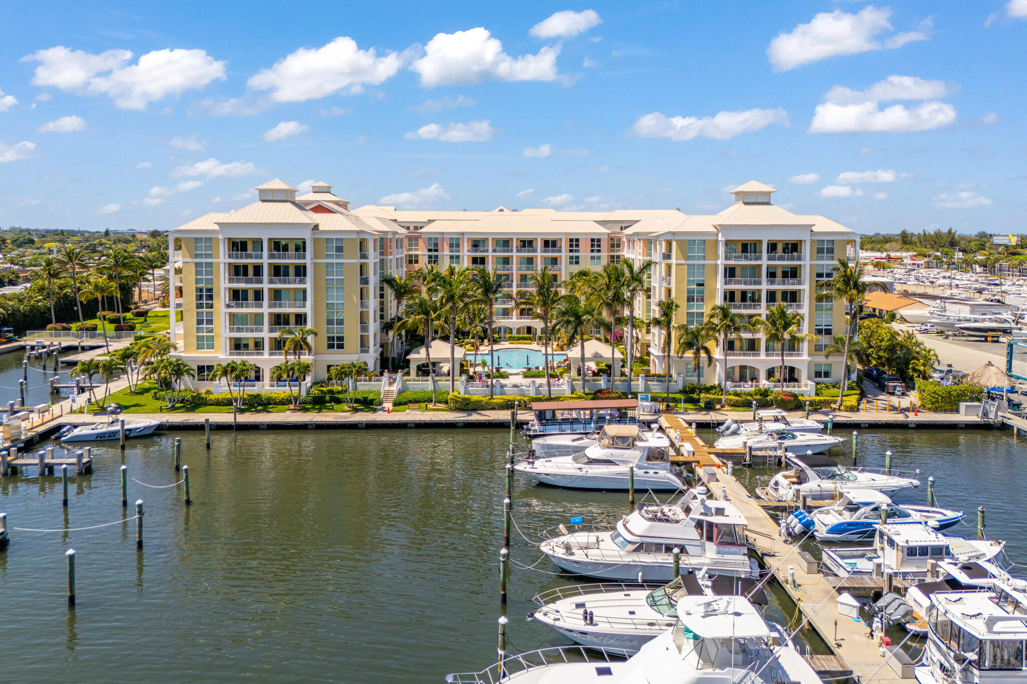 Your view of the water and boat-filled docks on the intercoastal from the soaring 9 foot floor-to-ceiling windows in this renovated unit can be your paradise!  This beautiful 2005 Key West inspired building is your Florida dream.  Freshly painted and tiled, this split-plan model offers 2 large walk-in closets in both bedrooms, extra storage in the kitchen and 2 linen closets.  Washer and dryer in unit with extra shelving.  All windows and doors are impact.  The kitchen provides ample storage and top line appliances. Amenities include secure indoor parking, valet service, 24-hour staffed security, optional marina and boat club, 2 pools, state of the art fitness center, clubhouse and cafe. A bridge away from Hypoluxo Beach and Manalapan.  Stay on vacation when you call this home!