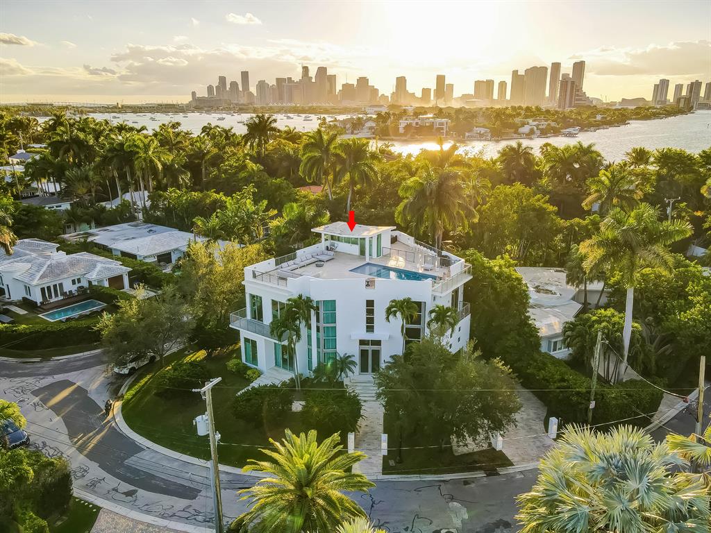 Contemporary luxury at it's finest!  This unique home boasts 360 degree panoramic views of Biscayne Bay from the enormous 1900 square foot roof top terrace and negative edge pool.  Sitting at the northern point of the island on a 7406 sq ft lot provides you with the privacy you desire.  10 Plus Foot ceilings throughout with a double height entryway and elevator, the home greets you like a luxury hotel.  Brand new furniture, design, and window treatments by Colvin Design.  Brand new Savant smart home system controls security cameras, alarm system, lighting, music, thermostats, and entry.  3 Brand New A/C Units, brand new tankless gas hot water system, brand new natural gas cooktop.  Freshly painted inside and out. Floors have been refinished and sealed.  Furniture/Decor are negotiable.