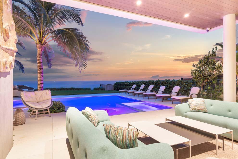 Spectacular oceanfront estate meets modern luxury. This trophy property is newly constructed and designed to invite the seaside experience in while showcasing inspirational pieces from all over the world including Italy, France, and Africa. The resort-style residence offers breathtaking ocean views throughout; multiple living areas; 5 bedrooms; 6 full and 4 half baths; upper-level lounge with full bar; and expansive terraces. The tropical outdoor oasis features private beach access; outdoor kitchen; pool with spa; and manicured landscape. Luxury amenities include full gym; 5-car garage; motorized privacy gate; Crestron sound and lighting system through; and more. This luxurious residence was developed by respected team of Seadar Builders; Randall Stofft Architects; and Sola Interiors. FEATURES:
" Direct oceanfront luxury residence with private beach access
" Newly constructed and designed by Seadar Builders; Randall Stofft Architects; and Sola Interiors
" 5 bedrooms / 6.4 baths
" 7,302 square feet under air / 10,815 total square feet
" Prime A1A location in the Town of Highland Beach between Delray Beach and Boca Raton 
" Gated entry and privacy wall
" Decorative driveway with ample room for parking
" Custom front door
" Open living areas with breathtaking ocean views
" Kitchen with snack bar seating; dining area; Subzero refrigerator/freezer with wine column; Wolf range; Miele coffee maker; and Viking ice maker
" Third floor game room; lounge area; and bar with drink refrigerator
" Morning bar on second floor
" Ground floor gym with sauna and powder room
" Custom elevator
" Covered loggia; summer kitchen; heated pool and spa; seaside terrace; and private path to beach
" 3+ car air-conditioned garage with porcelain floors and large storage room
" Navion gas hot water heater
" Honeywell AC
" Security system
" Crestron full home system
" Automatic blinds throughout most of the residence
" Custom lighting throughout 
" Designer wall coverings throughout
" The Town of Highland Beach has a library, post office, water plant, fire department and police department that offers patrol service