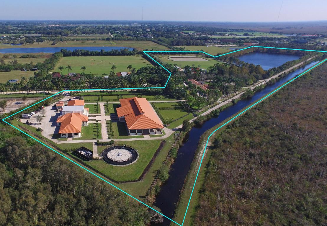 Absolutely stunning equestrian estate on over 29 acres, featuring completely renovated 6bed/7.1bath home. Property has own private lake with surrounding track. Beautiful custom brand new barn features two wings of 10 stalls each for a total of 20 stalls, each wing with own bathroom, feed room, tackroom and storage room, plus there is an additional 10 stall completely renovated barn. Never run out of riding space between the brand new oversized covered arena with high and bright ceilings, and outdoor dressage arena, outdoor jumping arena and Grand Prix field. Peacefully surrounded by woods with winding bridle paths and lush landscaping everywhere you turn, all is thoughtfully designed, including top finishes and materials and fantastic style. SEE MORE --> DISCLAIMER: All information provided to you regarding this Property by the realtor and their associates has been obtained from third parties such as the Multiple Listing Service, public records and other sources. All Buyers should independently verify all information provided regarding this Property. The Sellers, Realtor and Broker make no representation as to the accuracy of this information. All Buyers should perform their own independent due diligence regarding this Property before executing a Contract for Sale and Purchase for this Property.