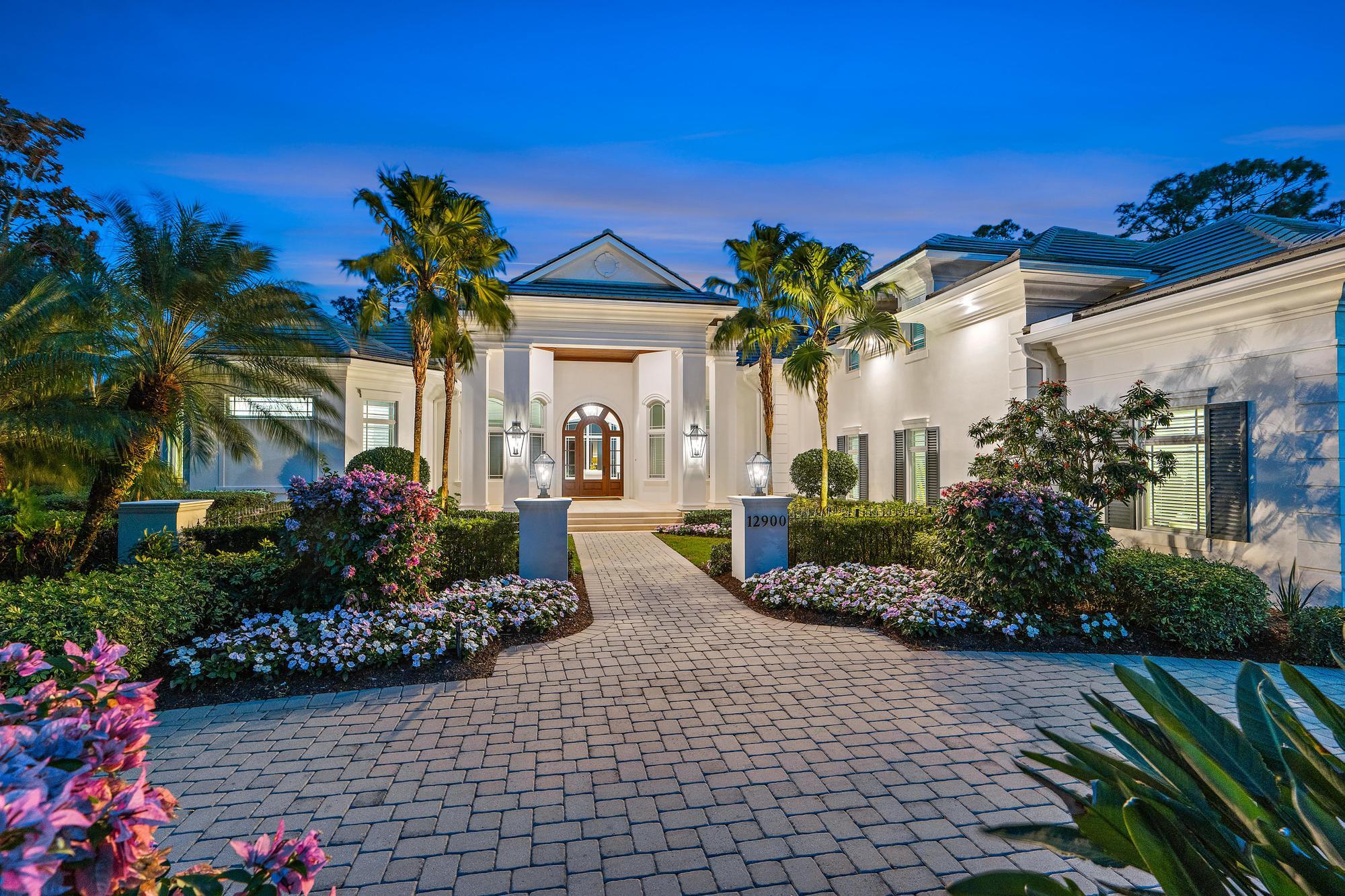 Fantastic opportunity to acquire this exceptional 3BR/5.1BA residence boasting a bonus room with full bath, elegant office/den, three-car garage and separate golf cart garage, all on a spacious 2/3-acre lot within the esteemed, gated club community of Old Marsh Golf Club. Crafted by renowned G.W. Purucker Homes, this custom-built estate showcases the finest finishes in a timeless, transitional design.  With over 4,500 sq ft of living space and an expanded outdoor living area, this home is ideal for entertaining!  Delight in the Chef's kitchen while engaging with guests in the spacious great room.  The distinctive open floor plan seamlessly connects to the outdoor living area through pocketing sliding glass doors, leading to the covered patio with motorized screens, summer kitchen and... fireplace.  Every detail in this exquisite residence reflects meticulous attention including beautiful millwork, 14' ceilings, Andersen impact windows and doors, full wet bar and a grand entry that is a must-see!  The freshly painted exterior and landscaped surroundings further enhance the appeal of this remarkable home.  This oversized property sits adjacent to the picturesque Par-3 16th hole of the Pete Dye Championship design and celebrates a beautiful swimming pool and spa that highlight the spacious and private grounds.  A few of the photographs are virtually staged.