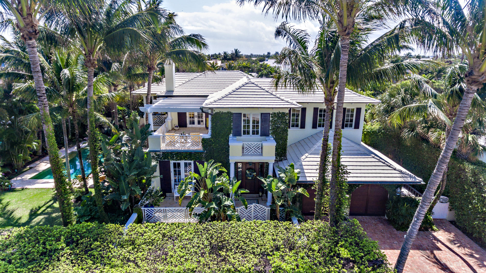 Beautiful British West Indies style island home located three houses off the beach offers exceptional finishes and casual elegance. This property offers 4 bedrooms, 5.1 bathrooms, a 2-car air-conditioned garage, heated pool and a shared beach cabana. Features include large living spaces, Downsview Kitchen cabinets, Viking gas range with double ovens and a copper hood, a formal dining room with high ceilings and a fireplace. The large master suite offers volume ceilings, a large bathroom with a steam shower, a large walk in closest and two private balconies. Additional features include a second floor sitting room with wet bar, impact windows and doors, a water filtration system for the house and zoned irrigation system and a whole house generator. Exterior features include a heated pool, copper gutters, an outdoor grill plus a cabana with refrigerator drawers/ice maker and full bath.