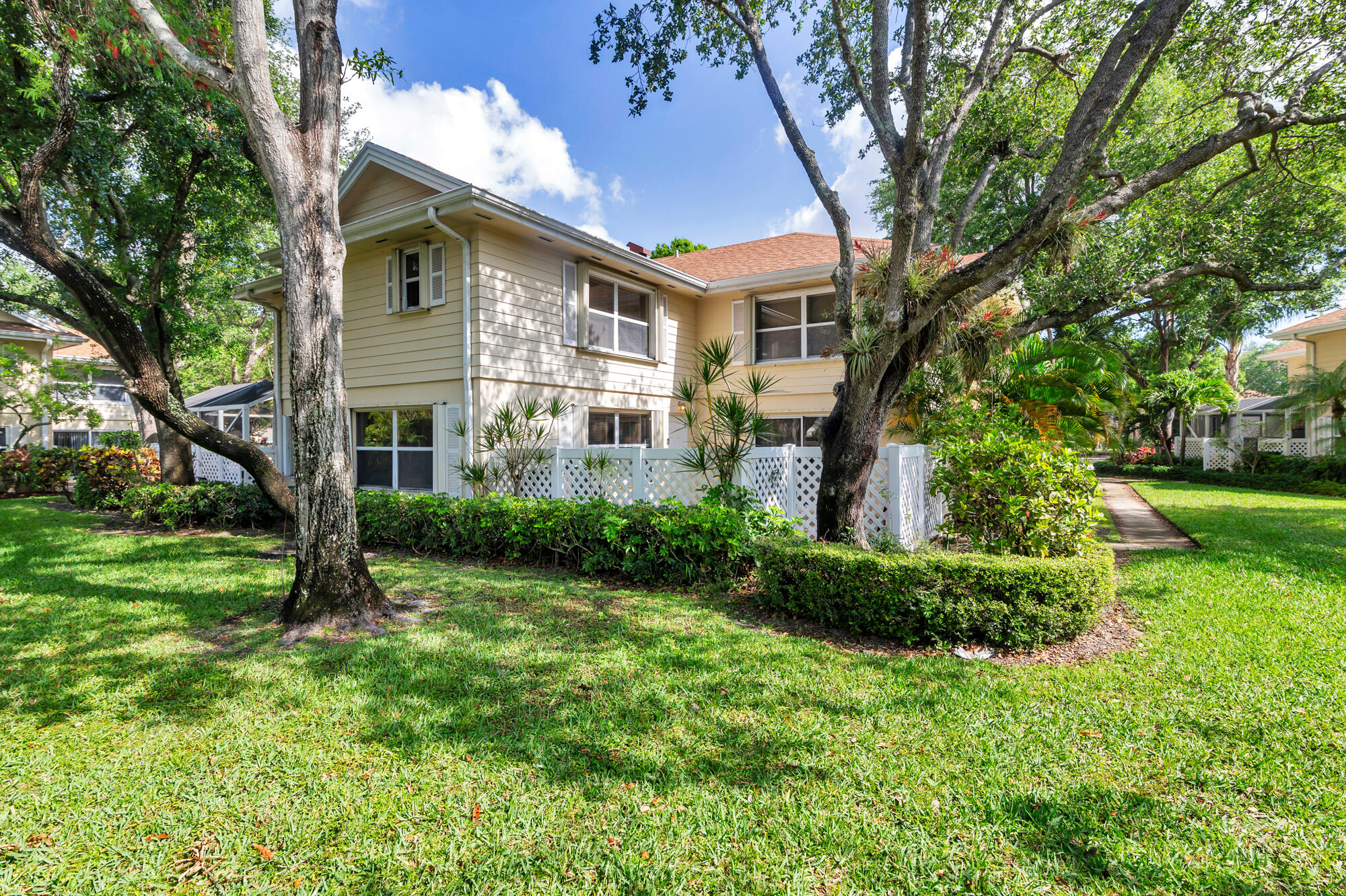 Updated 2 bedroom, 2.5-bathroom DiVosta built townhouse in the gated Wellesley at Lake Clarke Shores community. Upgrades include a fully renovated eat-in kitchen, and laminate floors. The HOA covers water, sewer, trash, cable, exterior maintenance and insurance, roof maintenance, parking, lawn care, management fees, and reserve funding. Convenient to I-95 and minutes to Palm Beach, downtown West Palm Beach, and the beaches. The community boasts mature landscaping and features a 24/7 manned security gate, a community pool, tennis courts, playground, walking trails, a lake and much more.  Security gate. Parking restrictions: No trucks, RVs, or motorcycles allowed. No lease first 2 years of ownership. Accordion shutters for all windows and sliders. Cable and water included. Reasonable HOA of $1773 due quarterly.