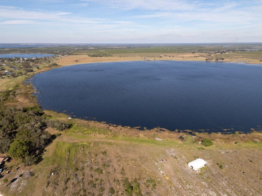 ALMOST 400 ACRES OF RESIDENTIALLY ZONED LAND IN HIGHLANDS COUNTY!This waterfront residential land presents a rare opportunity to own a prime parcel with over 8,000 ft of frontage on Lake Pythias, more than 75% of lake shoreline. Spanning across the border of Polk and Highlands counties, the land is zoned for residential development with approval for 1,100 units. Central water is available. Centrally located north of Avon Park, the property is just minutes from local infrastructure, adjacent to River Greens Golf Course. Easy access to major highways. The county is highly supportive of development in the area, no impact fees.THE LAND IS PRICED $9M TO SELL AS IS (Price reduced from $15M)THE SELLER IS OPEN TO WAIT FOR ALL ENTITLEMENTS APPROVAL WITH PRICE OF $13M, TERMS ARE NEGOTIABLE.