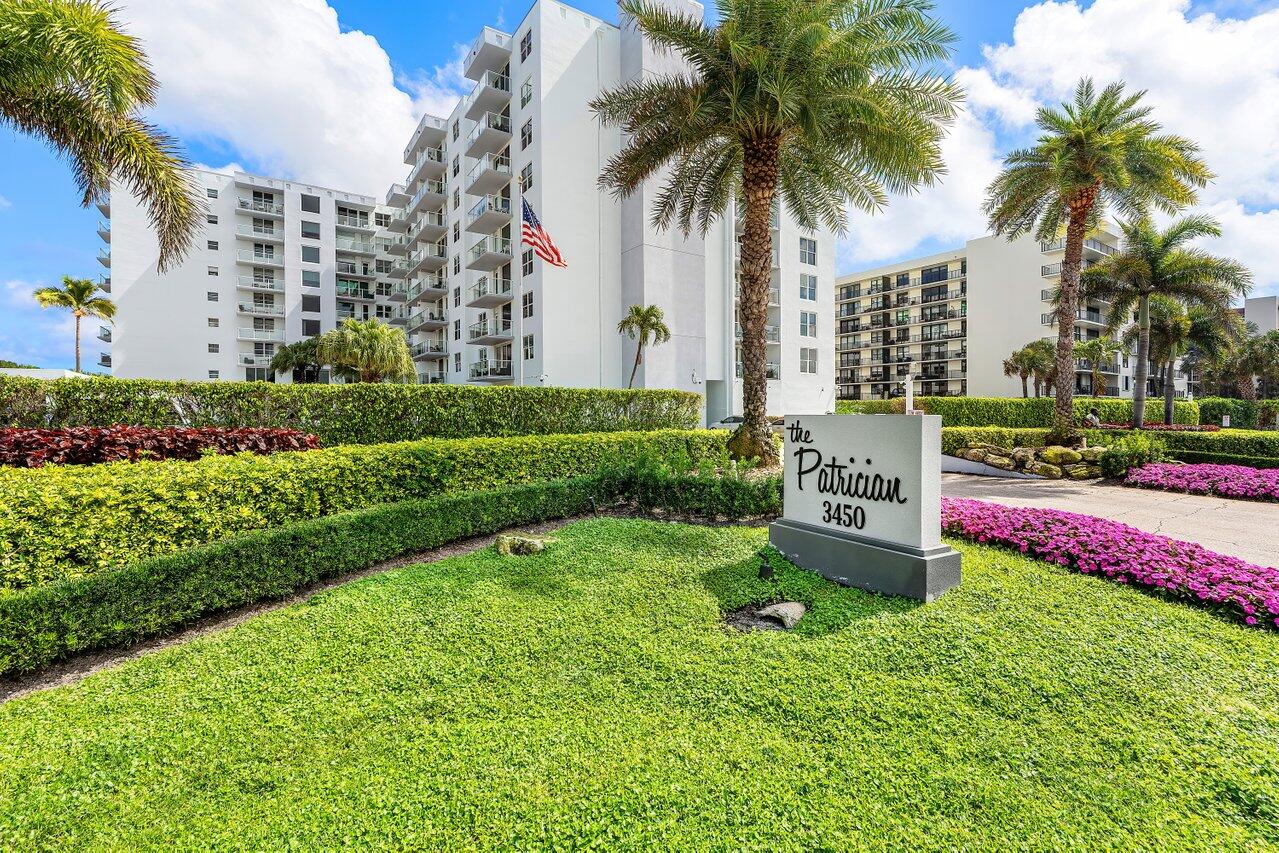 Located on the oceanside in South Palm Beach, this beautifully renovated 2-bedroom, 2-bath residence offers 1,548 square feet of living space--larger than most two-bedroom units in the building--and showcases sweeping views of both the Atlantic Ocean and the Intracoastal Waterway. Enjoy spectacular sunrises and sunsets from your private, covered balcony complete with modern glass railings to optimize the views. This open-concept split floor plan features spacious living and dining areas designed for effortless coastal living and entertaining, complemented by tile flooring throughout, Upgraded bathrooms, a  gourmet kitchen and a built-in bar. Impact windows provide abundant natural light along with added storm protection and are enchanced by Hunter Douglas custom blinds. The Patrician condominium has recently completed extensive building renovations and offers exceptional amenities including a resort-style oceanfront pool & pool deck with lounge areas & an outdoor kitchen with BBQ grills, private beach access, and a fitness center. Two covered parking spaces are included. The monthly COA includes fully funding reserves.