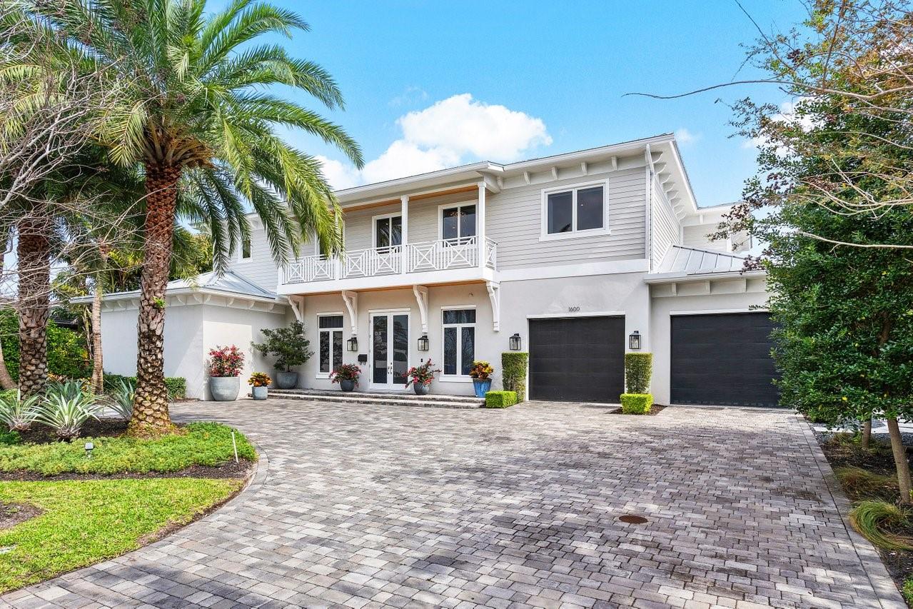 Dive into luxury at Harbor Beach! This 5-bedroom 6-bath custom home, nearly 6,000 sq ft, offers the Florida dream. British West Indies charm & modern finishes blend into soaring ceilings. The chef's kitchen is outfitted w/ Thermador appliances, wine column & a gas range. Unwind in the spacious 1st-floor primary suite w/ 3 stunning built-in closets & spa bath including 2 water closets. Each guest room offers a private bath. The bonus room can be used as an office, playroom or craft space. Host gatherings or relax in the heated saltwater pool & spa + outdoor kitchen, all surrounded by lush & private landscape. Optional private beach club access puts the sand & surf just steps away. Professionally curated designer furnishings are also included. Space for an elevator & car lifts in the garage.
