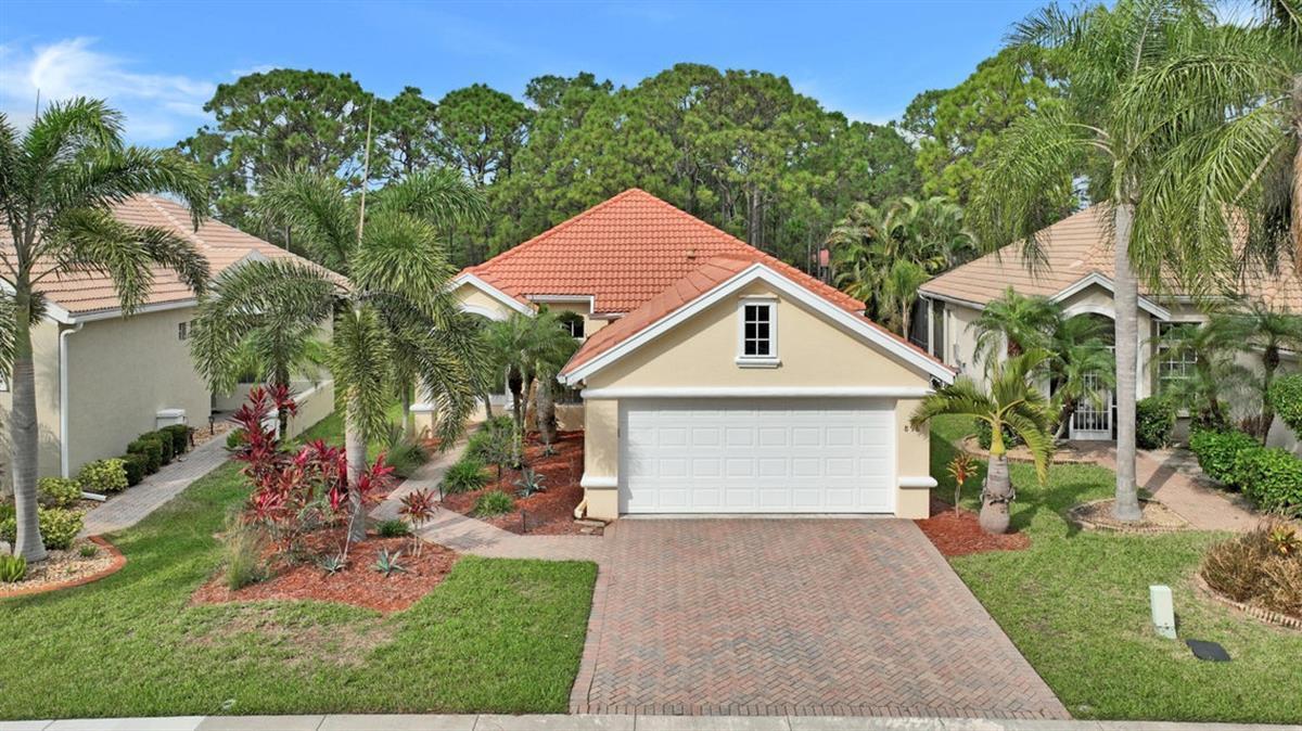 2/2 cute and cozy well maintained home in Lake Charles gated community, @ St Lucie West with a nice flowing floor plan, gourmet galley kitchen, spacious master bedroom, oversized screened enclosure, nice back yard facing the preserve.