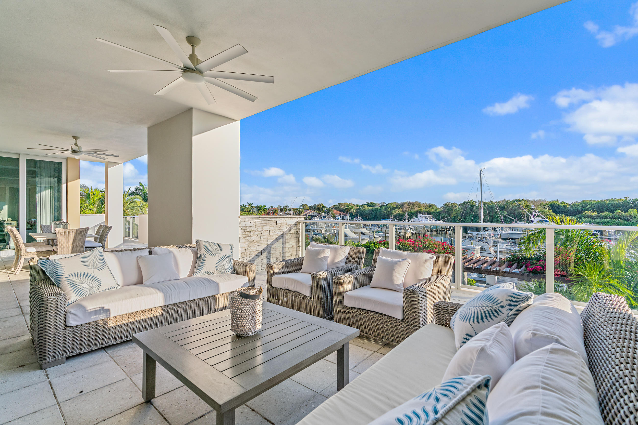 Being sold furnished and turnkey. Enjoy waterfront living at newly built Azure! Unit 205 is one of the largest in the building - it feels like a single family home with its 5,200 sq ft of living space and add'l 640 sq feet of terrace and balconies with wide waterfront views, while offering the convenience of lock-and-go condo living. You will find Italian white oak flooring, custom built-ins, smart home AV integration, Thermador appliances, motorized shades in every room, and a custom butlers pantry. This unit includes 3 garage parking spots, A/C storage, private keyed elevator, 10' ceilings, and impact glass. Building is pet friendly, too! Azure is a gated community with boutique concierge services and 5-star amenities. Residents can enjoy 24/7 manned gate, fitness center, his/hers locker rooms, sauna+ steam room, massage room, 2 heated swimming pools, cabanas, fire pit, club room w/pool tables, private wine cellar, putting green, golf simulator, and marina.