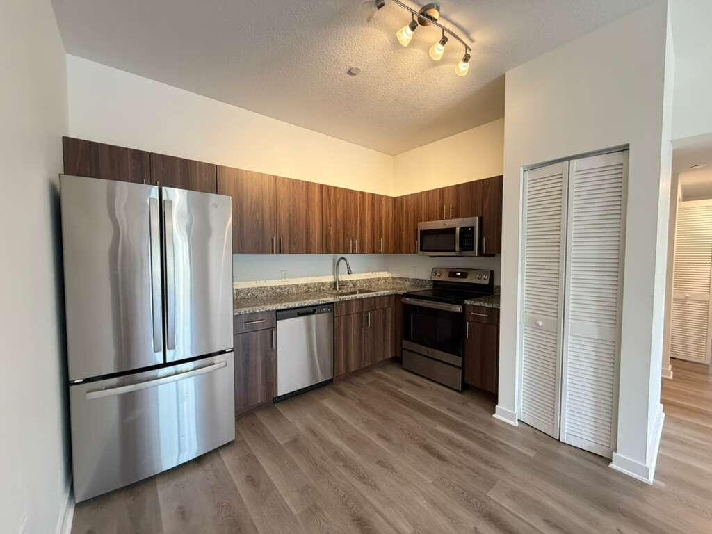 FREE FIRST MONTH! Enjoy comfortable living in this spacious 2-bedroom, 2-bathroom apartment with NO HOA, located in the desirable Lakewood Villas community in Lake Worth Beach. With 1,100 square feet of living space spread across three levels, this residence offers a unique and functional layout, central AC, in-unit washer and dryer, complemented by brand-new vinyl flooring throughout. The multi-story design provides separate spaces for living, relaxing, and entertaining while maintaining a cozy feel. This community features an outdoor barbecue area and playground. Conveniently located near shopping, dining, and major roadways—this unit is a fantastic opportunity to enjoy all that Lake Worth Beach has to offer.  Rent is $2,200 per month, plus a flat fee of $170 for Water and Wi-Fi, for a total monthly cost of $2,370.