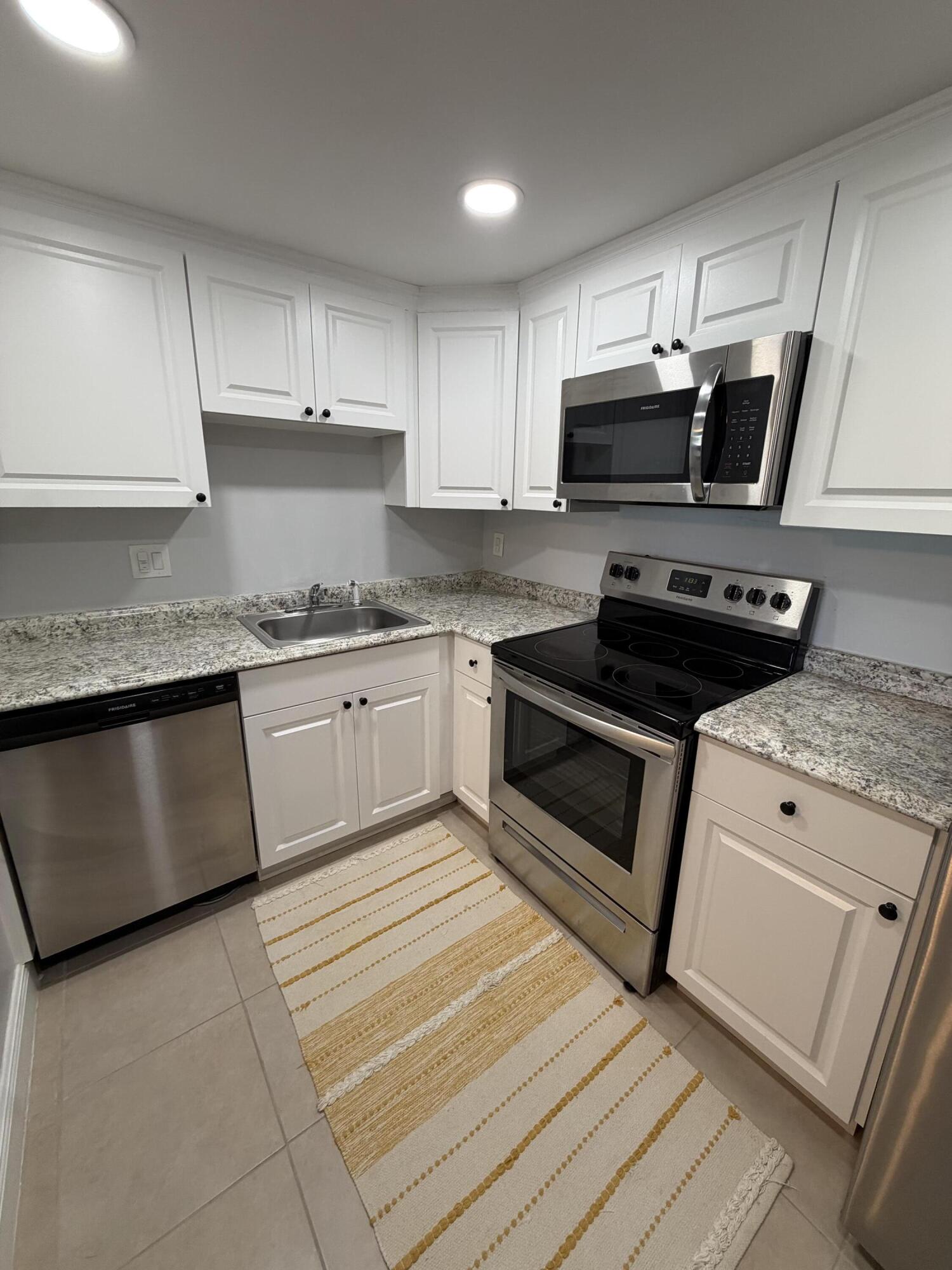 Beautifully updated 1-bedroom, 1-bath residence located in the desirable Manors of Inverrary community. This unit features a spacious and functional layout with a large primary bedroom, walk-in closet, and an open, airy living area filled with natural light. The home showcases modern finishes including elegant tile flooring throughout, recessed lighting, and a fully renovated kitchen equipped with stainless steel appliances. Brand-new washer and dryer installed. Enjoy relaxing moments on the private balcony offering pleasant views. The unit is maintained in pristine condition and provides a cozy yet contemporary living environment.