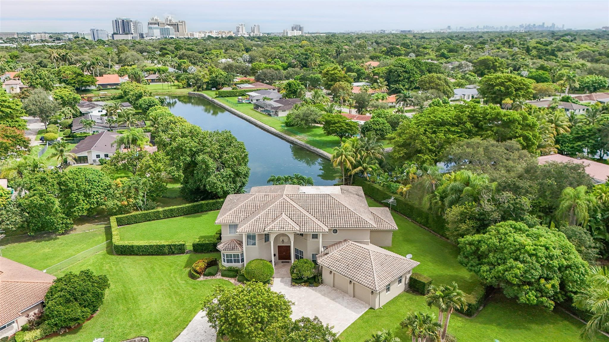 Welcome to the crown jewel of Pinecrest! This exceptional and timeless PINECREST estate, being offered for the first time by its original owners, has been meticulously maintained and custom-designed with every detail in mind. The stunning estate showcases 5 bedrooms (including a gym and a sitting area in the primary suite), 5.5 baths, 2.5-car garage, chef’s kitchen, recreation/pool room and a large custom-designed movie theater room for the ultimate in-home entertainment experience for your family and friends. Escape outdoors to your private oasis with a resort-style pool, spa, built-in BBQ and an expansive point waterfront and private cul-de-sac lot. Excellent opportunity to own in one of Florida's most highly sought-after places to live!