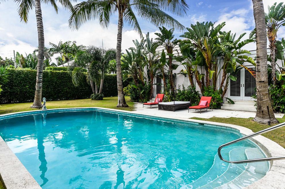 This Charming Bahama Lane residence offers 4,360 total square feet of living space with five bedrooms, and five and half baths.  Each bedroom offers an en-suite bath and closet.  Situated on a large 144' x 91' lot, the property features a wonderful pool area with green space, a large covered outdoor loggia, a living room with high ceilings and a bay window, a dining room with French doors that open to the outdoor loggia, and a spacious kitchen that also has doors to the loggia for easy entertaining.  The property is ideally located in close proximity to the beach and the Lake Trail.
