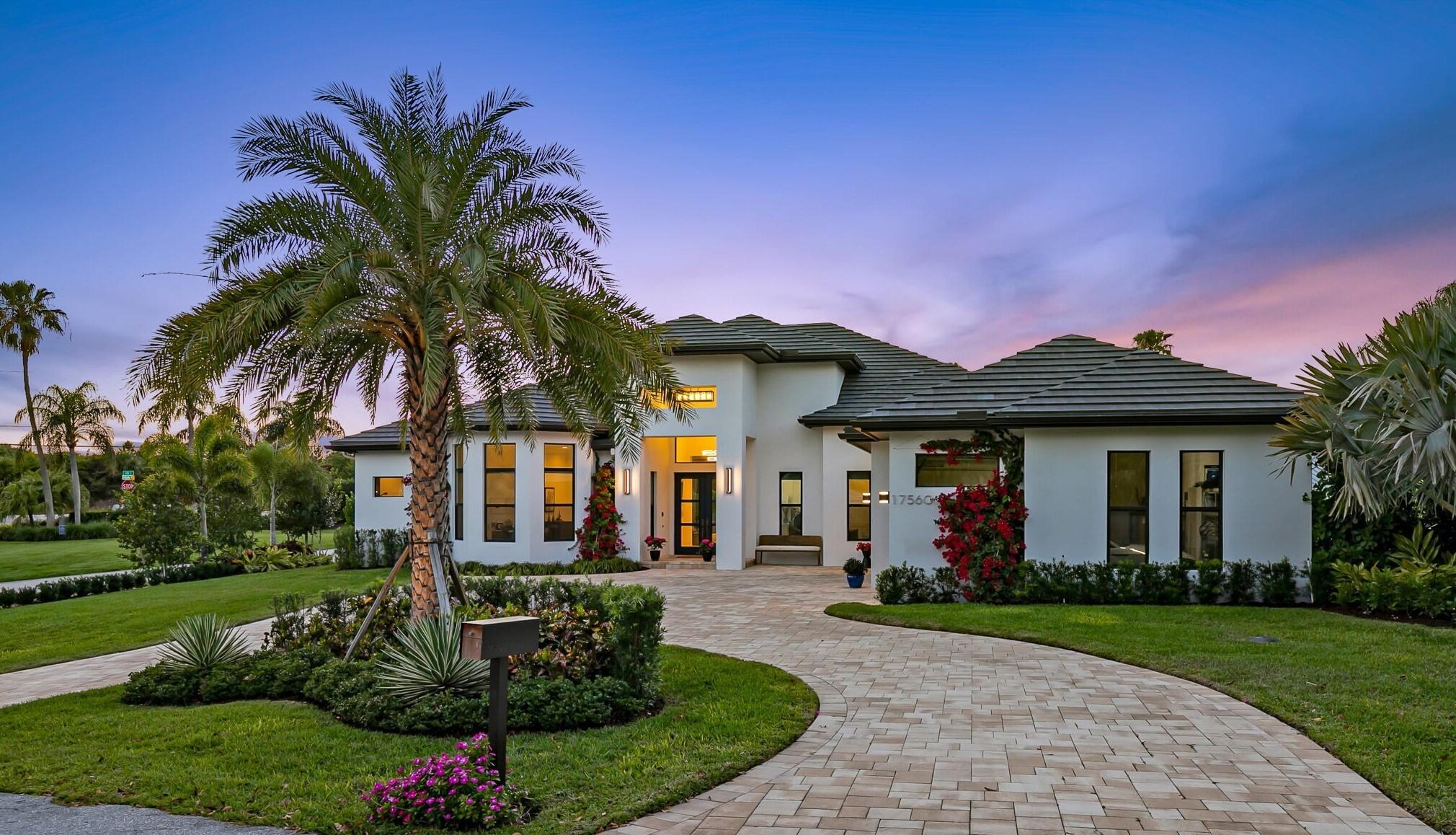 STUNNING! NEW 2021 CUSTOM BUILD in the Affluent IntraCoastal Neighborhood of Indian Hills, Jupiter. HIGH END DETAIL from the Mitored Roof Tiles eliminating ridge cap tiles to the Solid Wood Herringbone Hardwood Floors. The ATTENTION to DETAIL is BEYOND! Please refer to Details in Supplement. Whole House Generator. 220 Outlet for Electric Vehicle in 3 Car Garage.Remote Recessed Roll Down Screens at Covered Patio.Corner Close+Pocketing IMPACT SLIDERs.Custom Front Double Doors w/Solid Brass Hardware + Lock System.Large STONE Outdoor Wood Burning FIreplace. Spa ike Pool w Waterfalls+Beach Ledge.Travertine Patio+Circular Dr.Open Split Floor Plan. Custom Solid Wood Cabinetry.Gourmet Appliances.Wine Cellar.Huge Hidden Walk In Pantry. Natural Quartz Countertops. Designer LIGHT+PLUMBING See Docs