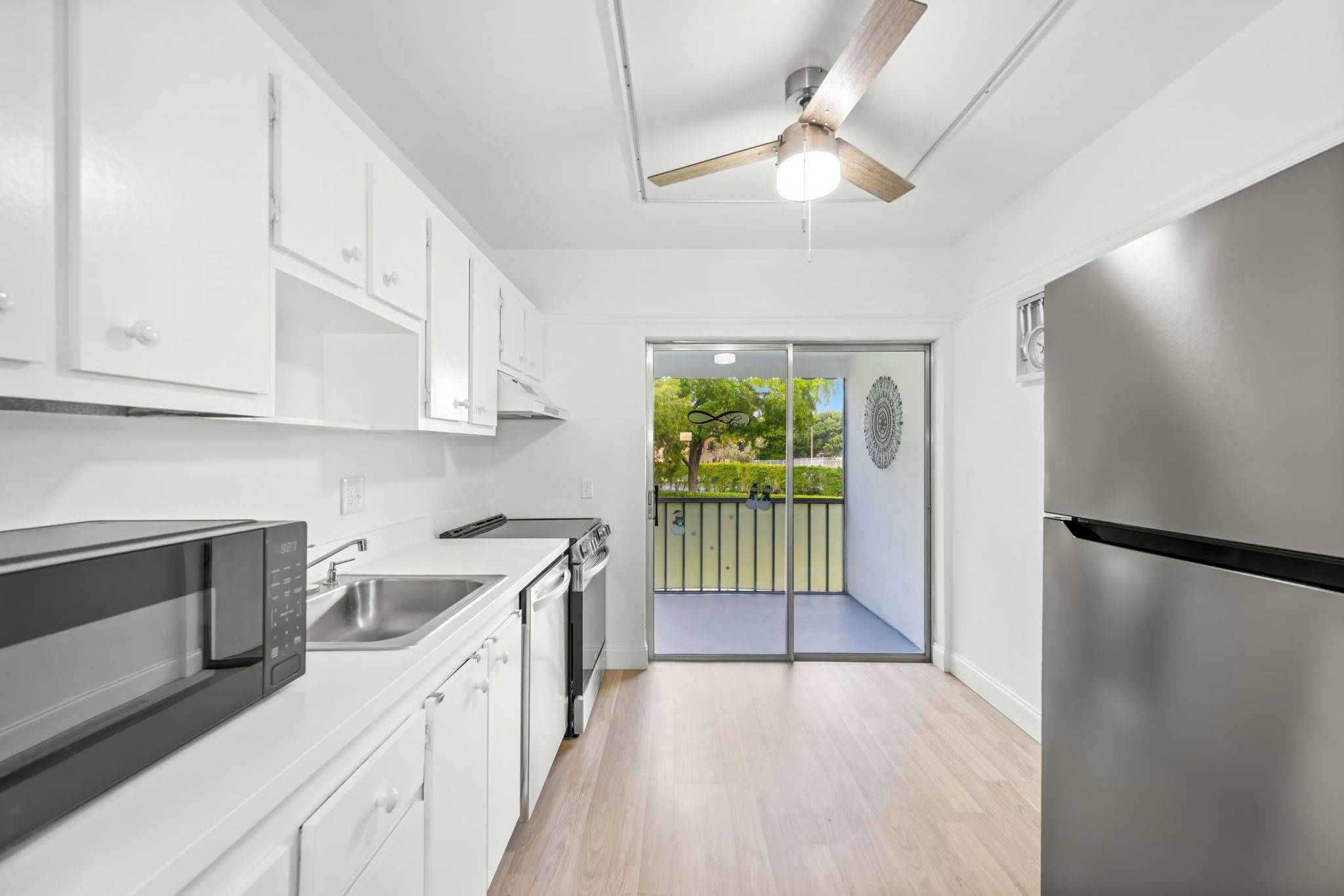 Love where you Live...Oriole Gardens III, Active 55+ Community with Lots of Fun Activities and Planned Events. This unit is just steps away from the Pool and Clubhouse. Freshly Painted, Beautiful New Wood tone Laminate Flooring throughout, Updated Kitchen and Bathrooms. New Light Fixtures, Ceiling Fans. Next door to the Laundry room and Extra-Storage space. Association Fee Includes Basic Cable & Water. Association Requires 700+ CS, POI $40k. 50 yr Inspection complete. NO RENTING and NO ASSESSMENTS (presently) Very Well Managed Community. Please use the attachments Seller has signed when writing offers. Make sure to add your buyers name and fill out the buyers portion.  Ty