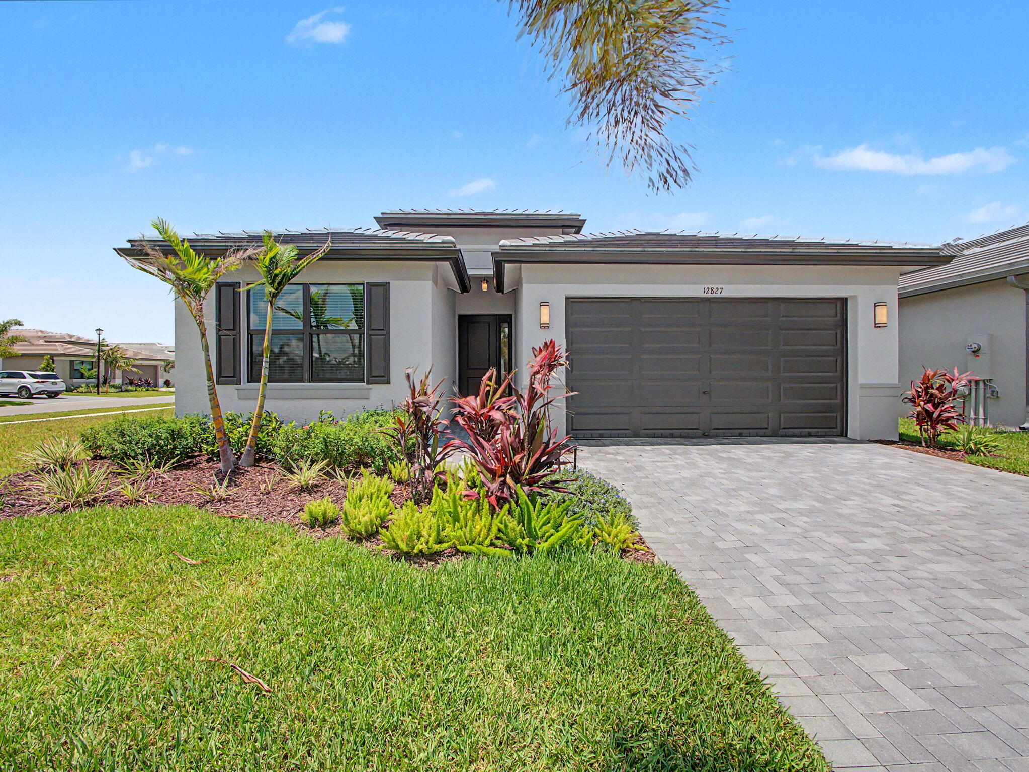 This Sanderling sits on a large Corner Lot and offers privacy with a partial lake view!  Two bedrooms with Den, 2 bath. Just one year old and ready for your personal touch!  The home features quartz countertops with a fully functional and seperate island, white cabinetry throughout, stainless GE appliances, partial lake view with screened lanai. Spacious bedrooms, baths. Features include quartz countertops, stunning tile floors and carpet in the bedrooms. Valencia Parc at Riverland Clubhouse is now complete and ready for you to enjoy!  This 38,000-square foot Clubhouse has resort-style amenities including the newest Riverland Restaurant, the Sunset Grille. Enjoy the 24-acre Sports & Racquet Club with more than 80 outdoor sport courts and a newly renovated Wellness & Fitness Center. If Art and creativity is your vibe express it at the Arts and Culture Center where you can create fine food, ceramics or simply plant your favorite flowers! Be sure to bring your golf cart and enjoy the Paseo and greenways that connects the amenities directly to each neighborhood throughout Riverland. Move for the lifestyle...it is truly like no other!