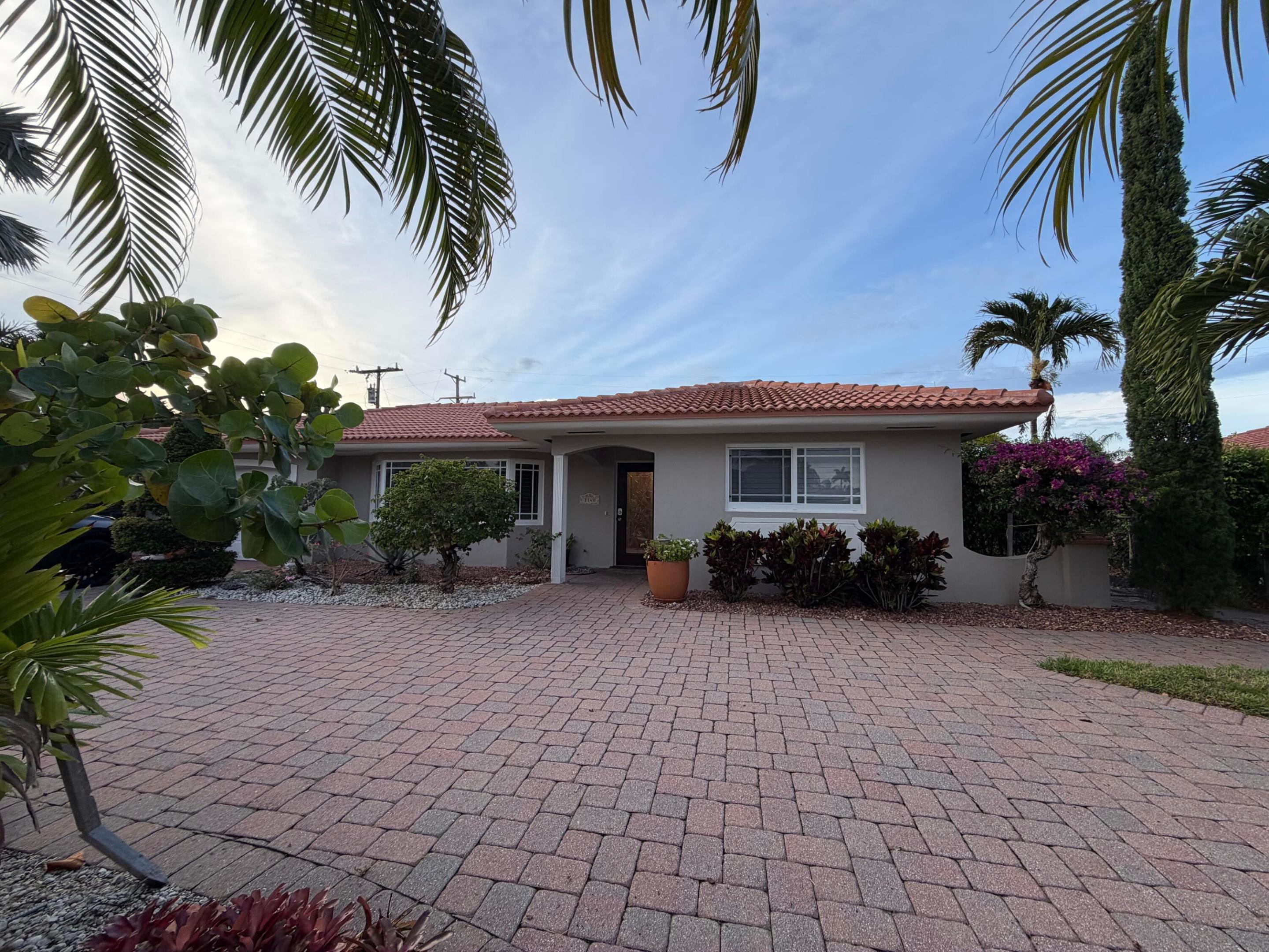 Discover your perfect temporary home on one of Palm Beach County's most desirable barrier islands. If you're relocating to the area and looking for a comfortable 2-6 month stay while you explore and purchase your forever home, this charming single-family house is the ideal solution. Just a short walk to the beach, this inviting 2-bedroom home with a versatile office (easily converted to a third bedroom or workspace) offers warmth, character, and soul throughout. Every window and door is impact-rated for peace of mind, and the home sits on a quiet, tree-lined street in a prime Singer Island location. Owner covers all utilities, including high-speed internet, lawn maintenance, and pest control — a savings of approximately $1,000 per month. Won't Last, must see