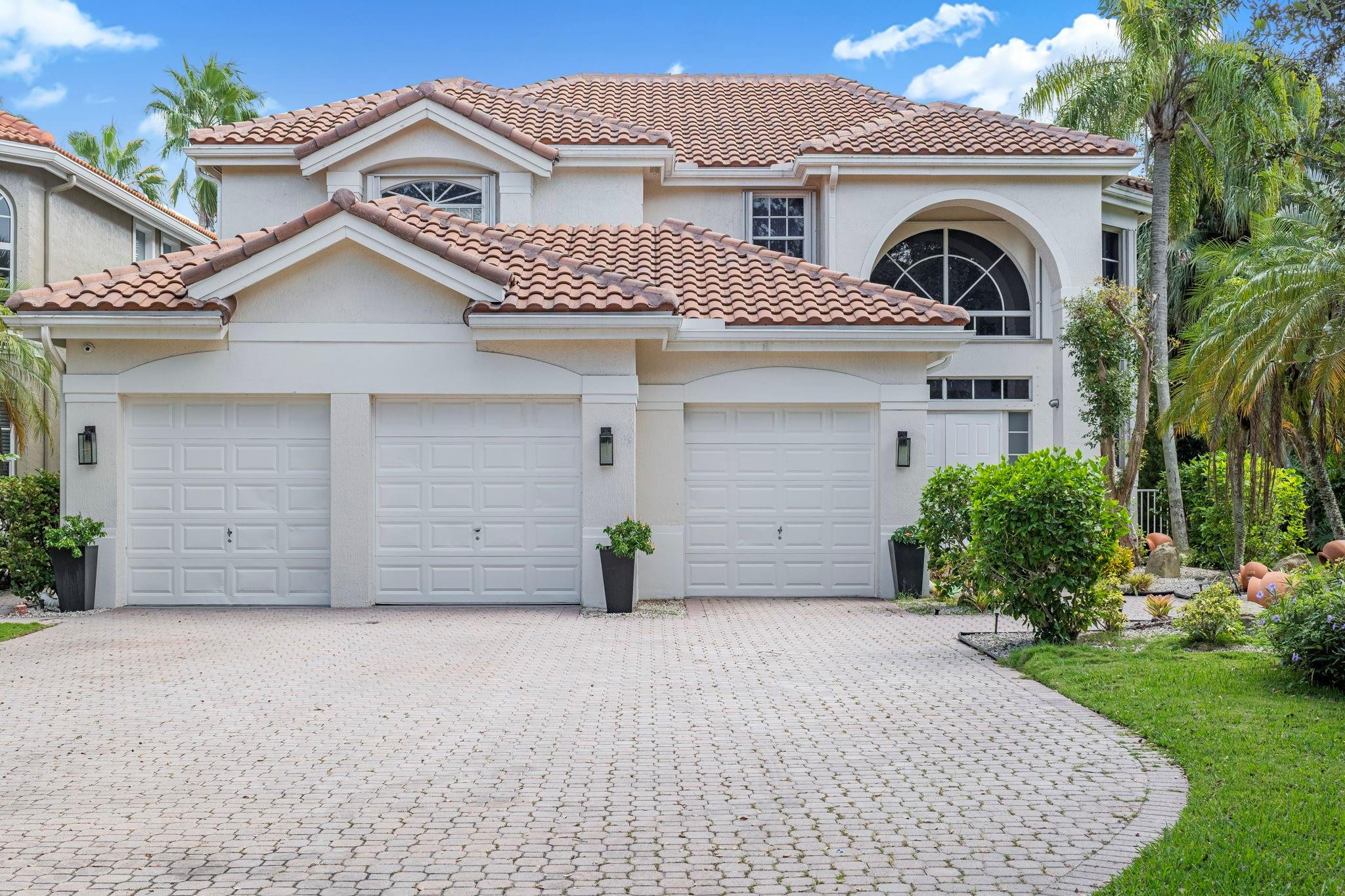 This highly sort out gated community, provides a renovated single family home nestled in a cul de sac for extra privacy. The home showcases a new roof in 2024 along with an updated kitchen and bathrooms. The true showpiece is the stunning outdoor space, where a sparkling pool and relaxing jacuzzi await—overlooking the lake. Not to mention, the resort-style amenities; pools, a children's water park, state of the art fitness centers, tennis, pickleball and  24/7 security. Heron Bay provides A rated schools and a tight-knit community  built around family life.