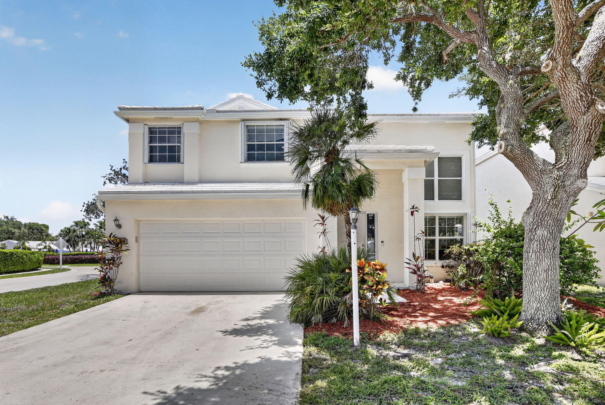 Beautifully stunning & updated 4/2.5, gated, move-in ready, this home features a completely renovated kitchen (2026) with quartz countertops, wood cabinetry, and new appliances. whole home engineered wood flooring, creating a seamless, modern living space. Additional improvements include an updated electrical system/panel, A/C 2022, fresh interior paint throughout, impact windows with accordion hurricane shutters, and a hurricane-rated garage door. The primary bathroom has been refreshed with a new vanity, shower door, and shower fixture, while the half bath features an updated vanity. The roof was replaced in 2015. Information deemed reliable but not guaranteed; Buyer/Buyer's Agent to verify.