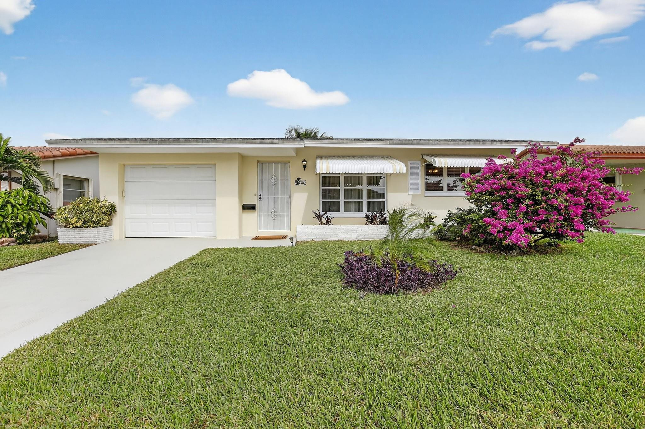 MAINLANDS GEM! FULLY FURNISHED, WATERFRONT HOME! Move-in ready 2-Bedroom home w/1-Car Garage positioned on a wide canal in the highly sought-after Mainlands 55+ Comm. Bright, spacious, & impeccably maintained residence feat an open floor plan & a glass-enclosed Florida room that fills the home with natural light & showcases serene water views from the moment you enter—ideal for both relaxing and entertaining. SS Appl w/ Dishwasher & Water Filtration System! Large Rectified porcelain floors throughout, neutral paint, beautifully decorated. Meticulously maintained. Enjoy the community's wonderful amenities: a sparkling pool and clubhouse. Conveniently located near shopping, dining, & major highways, this home offers both comfort and convenience! 730 Credit score required! No exceptions.