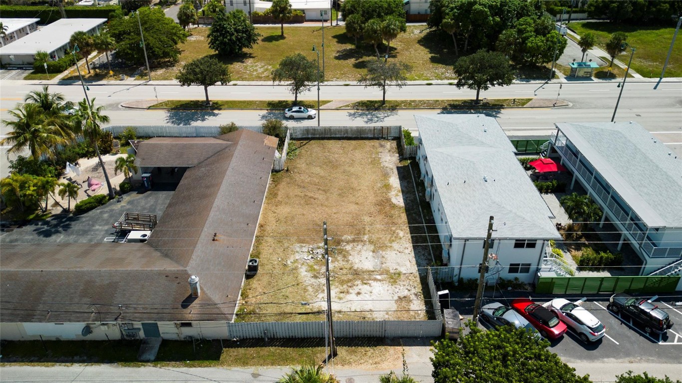 Here is an opportunity zone, BMUD - Mix Use District with incoming new construction of Northwood Village development 60,000 SF of commercial space and 300 apartments, plus small development around. Lot is in a heavily invested location. Up to 9-units apartment building construction allowed.Possibly owner financing.