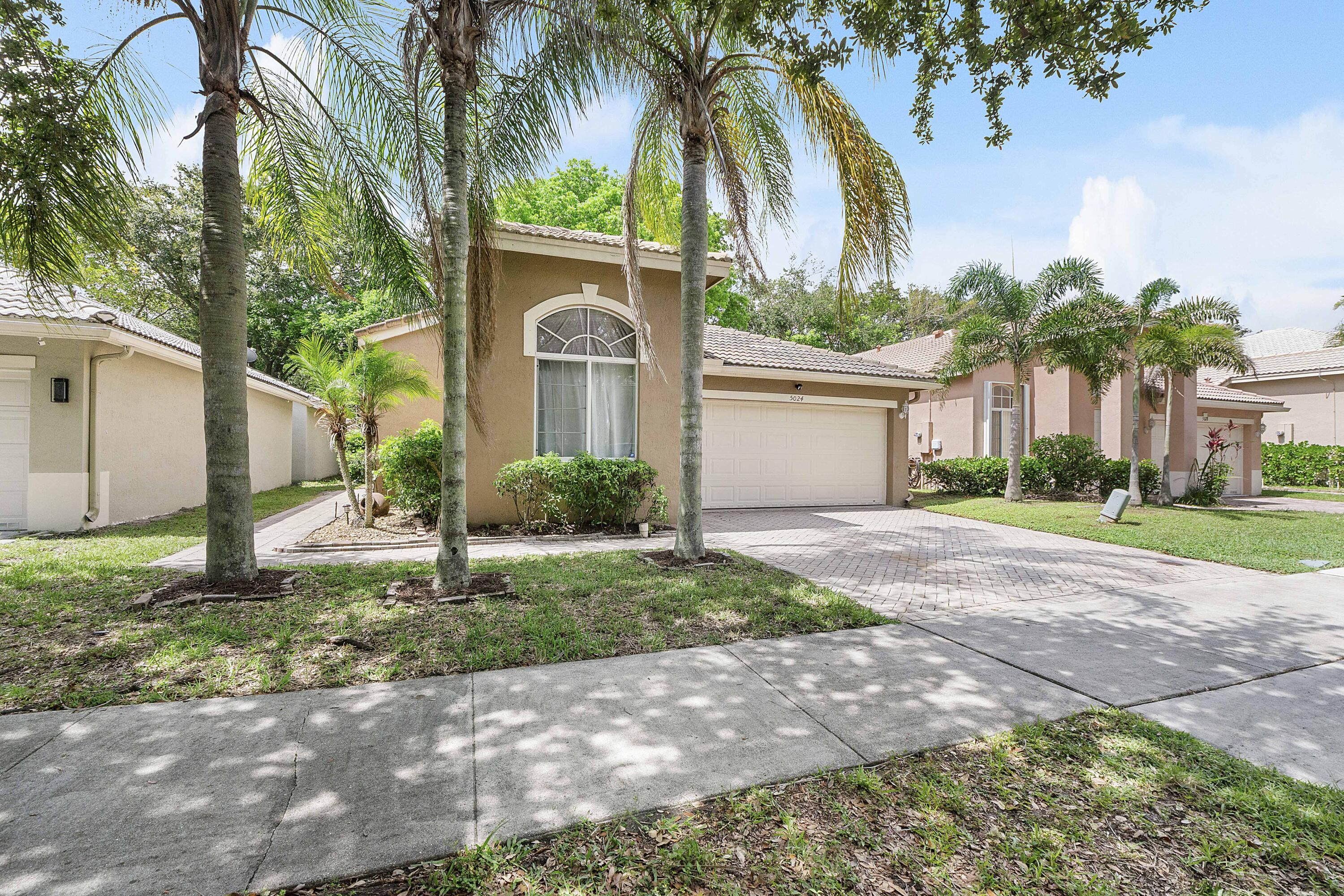 Beautifully updated and competitively priced, this inviting home in the gated community of Regency Lakes offers the perfect blend of comfort, style, and family-friendly living. Vaulted ceilings, crown molding, and an open-concept create a bright and welcoming feel throughout the home. The updated kitchen features granite countertops, white shaker cabinetry, stainless steel appliances, and expanded counter space ideal for cooking and entertaining. This open floor plan provides plenty of living space, an eat-in kitchen and stylish laminate flooring flows throughout. The primary suite offers an updated bath with modern cabinetry and a seamless glass shower. A flexible third bedroom with double-door entry is perfect for a home office/den, or guest room.  Enjoy relaxing outdoors on the private patio with mature landscaping with shade. Residents enjoy resort-style amenities including a central clubhouse, a fitness center, a swimming pool, a hot tub, a tot lot, and sports courts for basketball, sand volleyball, and tennis/pickleball, along with four satellite pools. Landscaping and high-speed internet included in the HOA. Conveniently located near shopping, dining, and major commuter routes. Move-in ready- this one won't last!