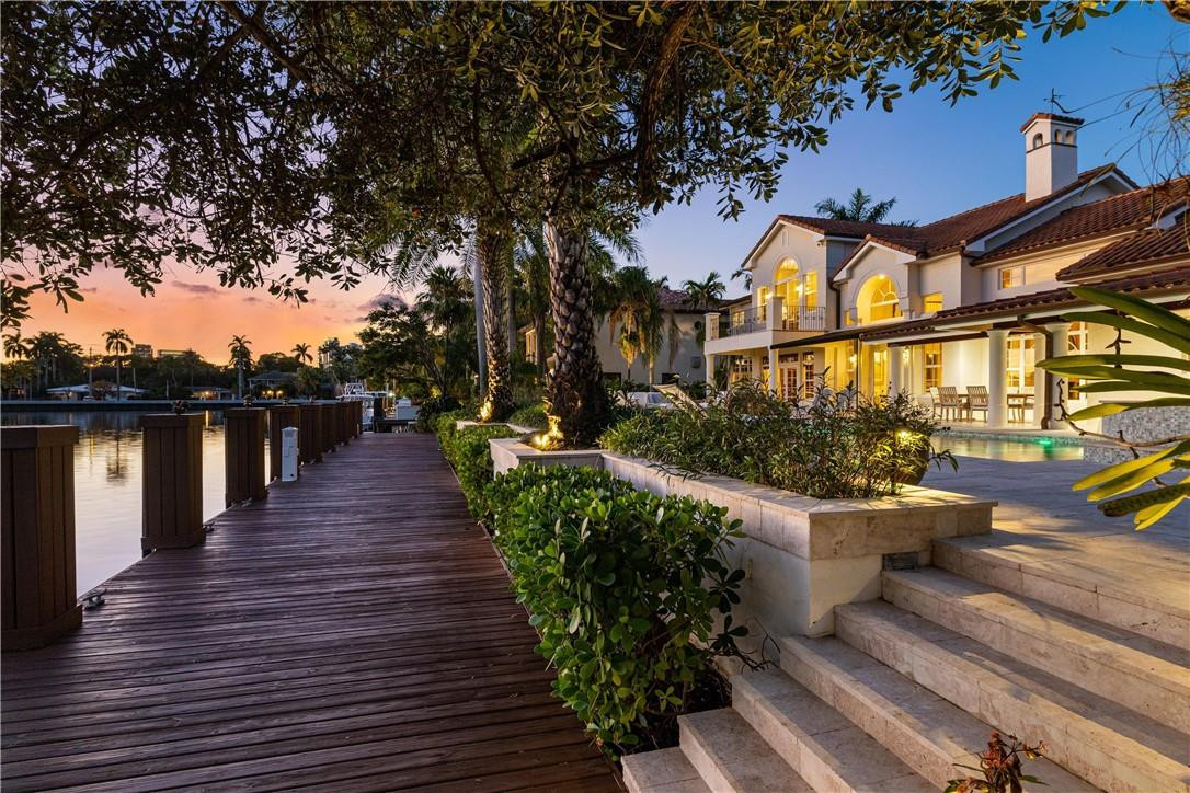 IT’s HERE. Exceptional waterfront living with easy access to the ocean while remaining in the heart of the city! This is a unique opportunity to live in the comfort and privacy of one of the largest lots (1/3 Acre+)in prestigious Rio Vista Isles. This elegant home features 5 bedrooms & 6.5 bathrooms, office, multipurpose billiard room with wet bar, 2 fireplaces, wood floors, natural light in every room enhanced by 6 skylights purposefully placed throughout the house, remodeled kitchen with Miele appliances. Master bedroom with private balcony.Exterior offers strikingly beautiful pool & whirlpool (salt system)on a magnificent deck with mesmerizing views of the water, outdoor kitchen and an astounding +/- 125ft waterfront dock. Breathtaking Sunsets! Impact windows,newer roof(2015)