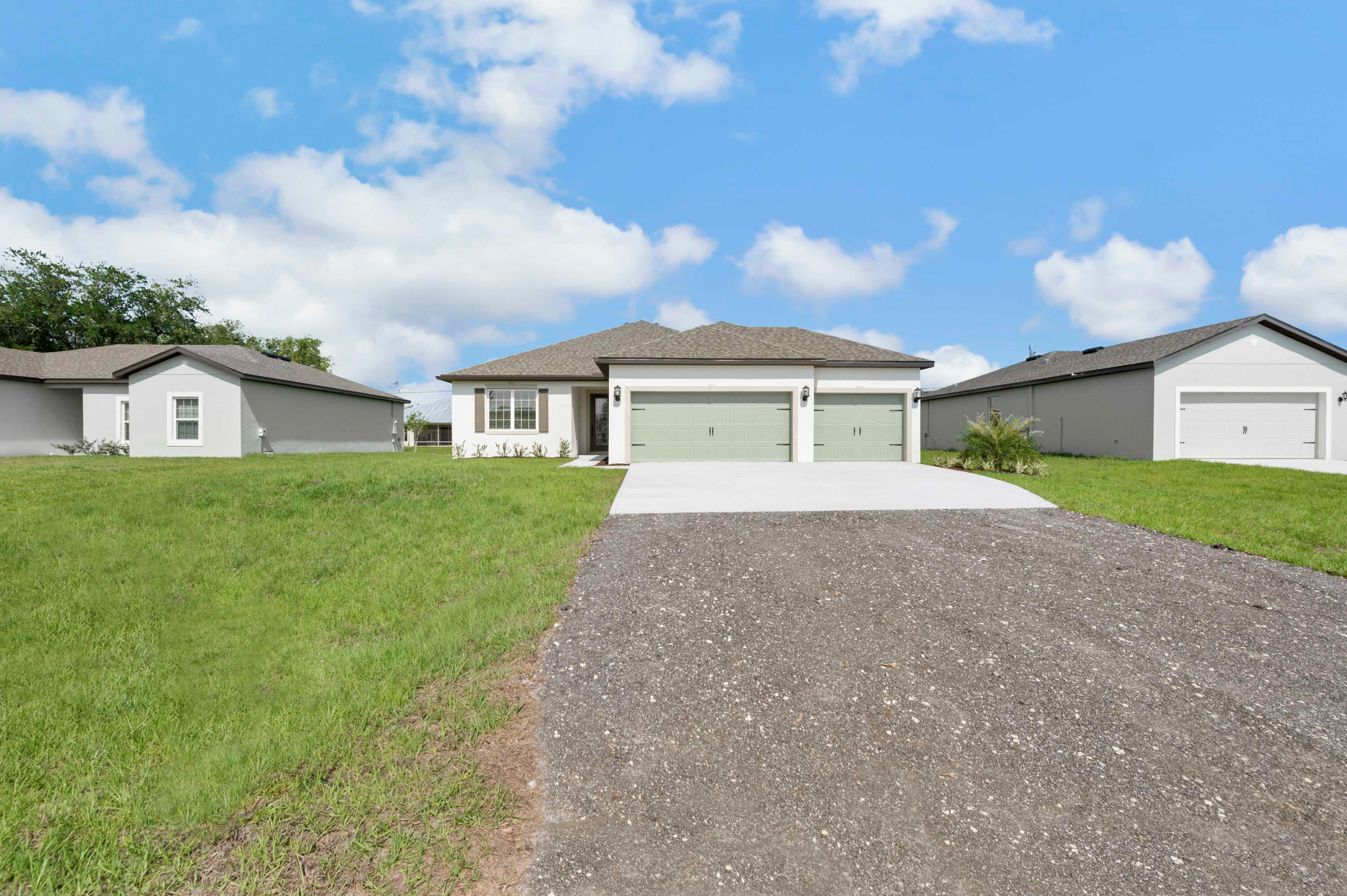 Ask about our builder-paid closing costs and no down payment options! Introducing the Jensen floor plan at Port St. Lucie - an ideal blend of style and functionality! This beautiful 3-bedroom, 2-bath home is packed with thousands of dollars in upgrades, including energy-efficient Whirlpool® appliances, spacious countertops, elegant wood cabinetry, and an attached three-car garage. The master suite is a true retreat with two large walk-in closets. Curb appeal is at its finest with a stunning covered entry and manicured front yard landscaping. Located in a prime area, Port St. Lucie offers residents access to amenity-rich parks, pristine beaches, and a wide range of water activities. This home offers exceptional value in a sought-after location! *Appliance models subject to availability.*