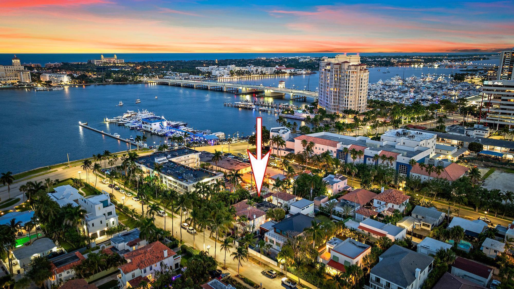 Just one property off Flagler Drive and three blocks from the vibrant NORA District, this exceptional property places you moments from CityPlace, downtown West Palm Beach, and Palm Beach Island. Tucked within the coveted Providencia Park neighborhood, this hidden gem sits just off the Intracoastal Waterway, offering both privacy and prestige. Spanning an expansive 13,939± square-foot street-to-street lot, this rare, potentially subdividable property is framed by lush tropical landscaping and brimming with future potential. Surrounded by significant new development—including luxury condominiums and the rapidly emerging NORA district—this prime location, paired with flexible zoning, presents a compelling opportunity to build, invest, or create a custom waterfront-adjacent estate. The beautifully restored 1930s Mediterranean Revival residence and guest house encompass approximately 4,712± total square feet, seamlessly blending timeless architectural charm with modern updates. A welcoming courtyard entry leads into the four-bedroom, two-and-a-half-bath main home, thoughtfully designed for both entertaining and everyday living. The light-filled living room, anchored by a cozy fireplace, offers an inviting gathering space, while French doors in the dining room open to the pool patio for effortless indoor-outdoor flow. A sun-drenched sunroom overlooks the manicured front gardens and charming fountain, adding to the home's character. The island kitchen and primary suite both open to the poolside loggia, with the first-floor primary serving as a peaceful retreat occupying its own private wing. Upstairs, guest bedrooms enjoy tranquil water views. Enhancing the property's versatility, the two-unit guest house—each with its own ensuite bedroom and kitchen—is ideal for hosting, rental income, or use as a poolside cabana. A detached two-car garage with a rooftop deck provides the perfect vantage point for catching Intracoastal breezes. With multiple living spaces, a flexible layout, dual laundry rooms, and exceptional indoor-outdoor living, this unique estate offers both an elevated lifestyle and a rare investment opportunity in one of West Palm Beach's most desirable locations.   DISCLAIMER: Information published or otherwise provided by the listing company and its representatives including but not limited to prices, measurements, square footages, lot sizes, calculations, statistics, and videos are deemed reliable but are not guaranteed and are subject to errors, omissions or changes without notice. All such information should be independently verified by any prospective purchaser or seller. Parties should perform their own due diligence to verify such information prior to a sale or listing. Listing company expressly disclaims any warranty or representation regarding such information. Prices published are either list price, sold price, and/or last asking price. The listing company participates in the Multiple Listing Service and IDX. The properties published as listed and sold are not necessarily exclusive to listing company and may be listed or have sold with other members of the Multiple Listing Service. Transactions where listing company represented both buyers and sellers are calculated as two sales. "No payments made until title passes" Some affiliations may not be applicable to certain geographic areas. If your property is currently listed with another broker, please disregard any solicitation for services. Information published or otherwise provided by seller, listing company or its representatives is deemed reliable but are not guaranteed and subject to errors, omissions, or changes without notice. Copyright 2026 by the listing company. All Rights Reserved.