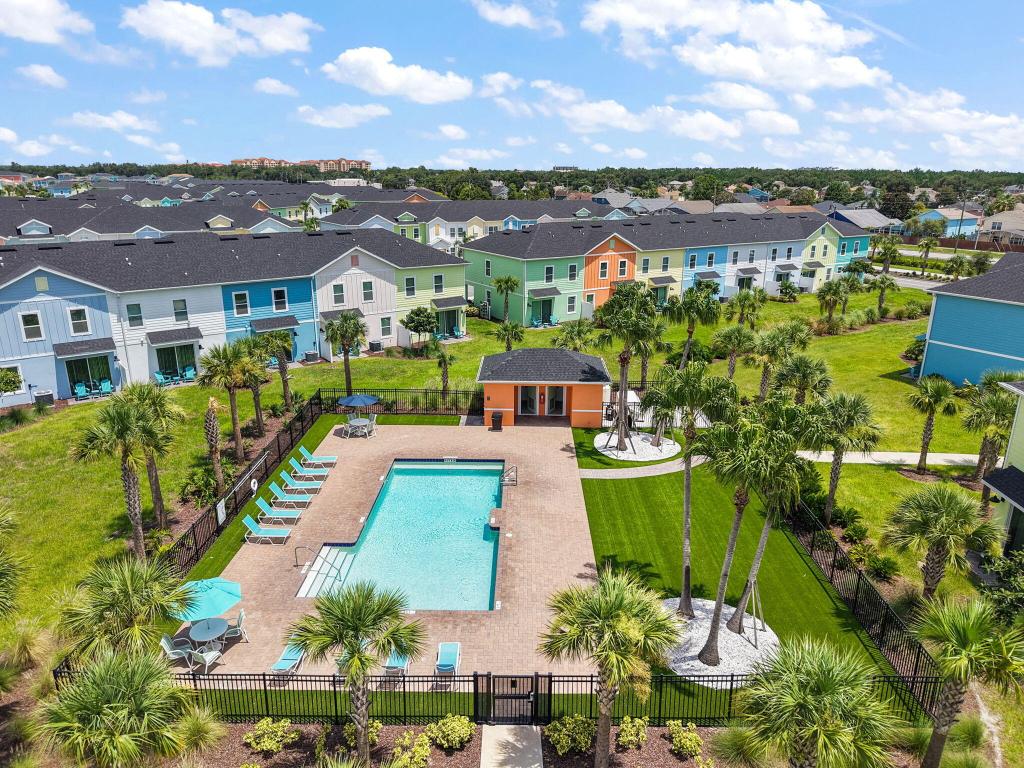 **Charming 2-Bedroom Townhouse with Versatile Loft in The Margaritaville Community**.Step into this brand-new, fully furnished, upgraded 2-bedroom, 2.5-bath townhouse, featuring an upstairs bonus room area that can easily serve as a third bedroom. Perfectly positioned within the desirable Margaritaville Community, this property is currently operating as a successful Airbnb, with continuous bookings that provide an exceptional investment opportunity. Annual ROI details are available upon request. Designed for comfort and relaxation, this home offers a spacious open-concept living and dining area, a modern full kitchen, and spa-style bathrooms that make every day feel like a vacation. Enjoy your morning coffee/evening cocktail from your private outdoor terrace, surrounded by a lush scenery. Located just minutes from Disney World, this resort-style community boasts a spectacular lagoon-style pool, a world-class water park, a luxurious spa, and a fully equipped fitness center. Plus, it's conveniently close to shopping, dining, and entertainment options. This property is the perfect choice for a primary residence, vacation home, or investment property.