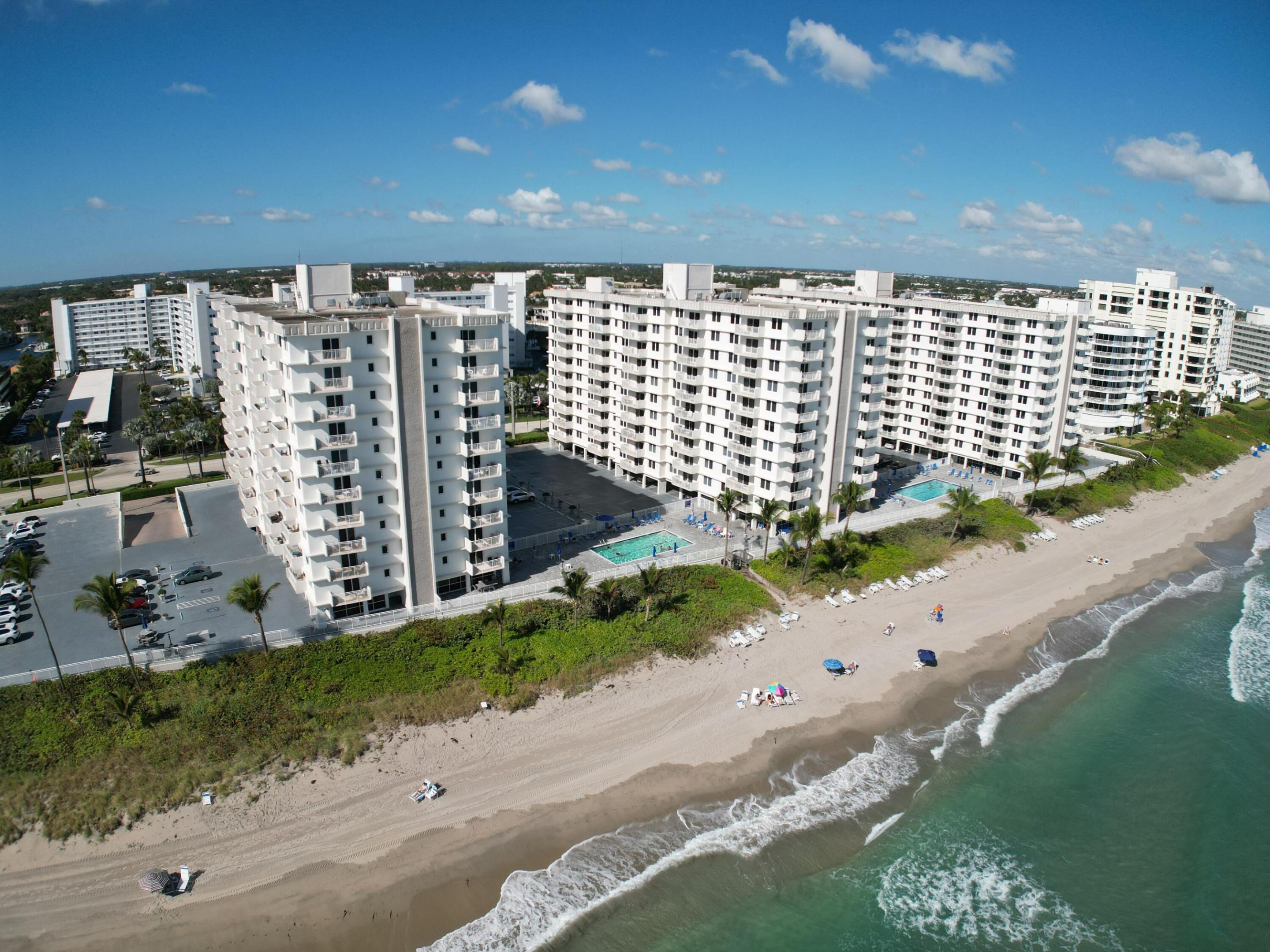 Welcome home to Highland Beach "3 Miles of Paradise" and this rarely available, highly coveted CORNER UNIT featuring two private BALCONIES with stunning ocean views & unobstructed, sweeping Intracoastal vistas—no neighboring buildings block your view. Relax as boats glide by, enjoy breathtaking sunset skies, and take in the twinkling city lights each evening. This light-filled residence offers sleek, consistent tile flooring throughout (no carpet), hurricane-impact windows and doors, abundant closet space, and a bright, open floor plan. Beautifully renovated and turn-key. Indulge in resort-style amenities including 2 pools, gym, sauna, billiards, private beach access, garage parking, and a secure guard-gated building. Ideally located just 10 minutes from Delray Beach's famed Atlantic Ave.  No need to carry a chair to the beach! Ambassadors has lounge chairs and sit up chairs for your convenience and use already on the beach.   Do you have a boat? No problem we have docks available!!!  Inquire with Suzette.  Ambassadors East is a responsible building and has an active board that takes excellent care of the building, Milestone renovations and SIRS reports have all been completed and there are no assessments.  Ambassadors is located in Highland Beach (a private beach) on A1A directly on the sand nestled between Linton Blvd and Spanish River Blvd.  Conveniently between Delray Beach and Boca Raton. It is a true Hidden Gem that you will be so glad you found and can call​​‌​​​​‌​‌​​​‌‌​​​‌‌‌​​‌​​‌‌​​​​ home!