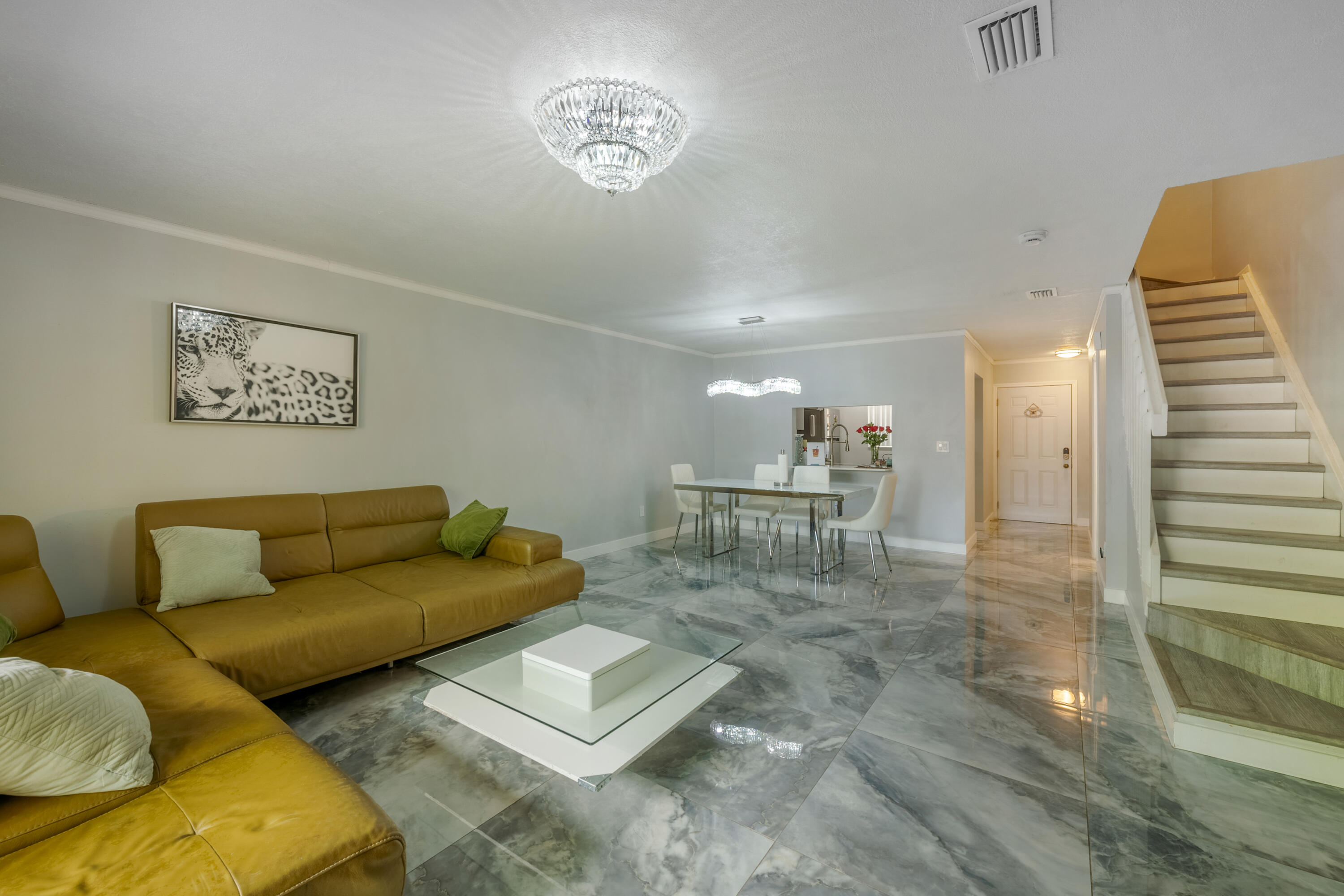 Welcome to this beautifully renovated and thoughtfully designed 2-bedroom, 2.5-bath townhome offering 1,296 sq. ft. of stylish, move-in-ready living space. Unlike a typical rental, this home was upgraded for personal living with quality finishes, a bright open-concept layout, spacious living and dining areas, a modern kitchen, beautifully remodeled bathrooms, and an oversized walk-in closet. Every detail reflects pride of ownership and exceptional maintenance. One of the home's standout features is the fully renovated private backyard, designed as a true outdoor retreat. Enjoy a beautifully finished patio, perfect for relaxing or entertaining, complete with a real sauna—a rare luxury almost never found in rental properties. The home is also equipped with security cameras for added convenie