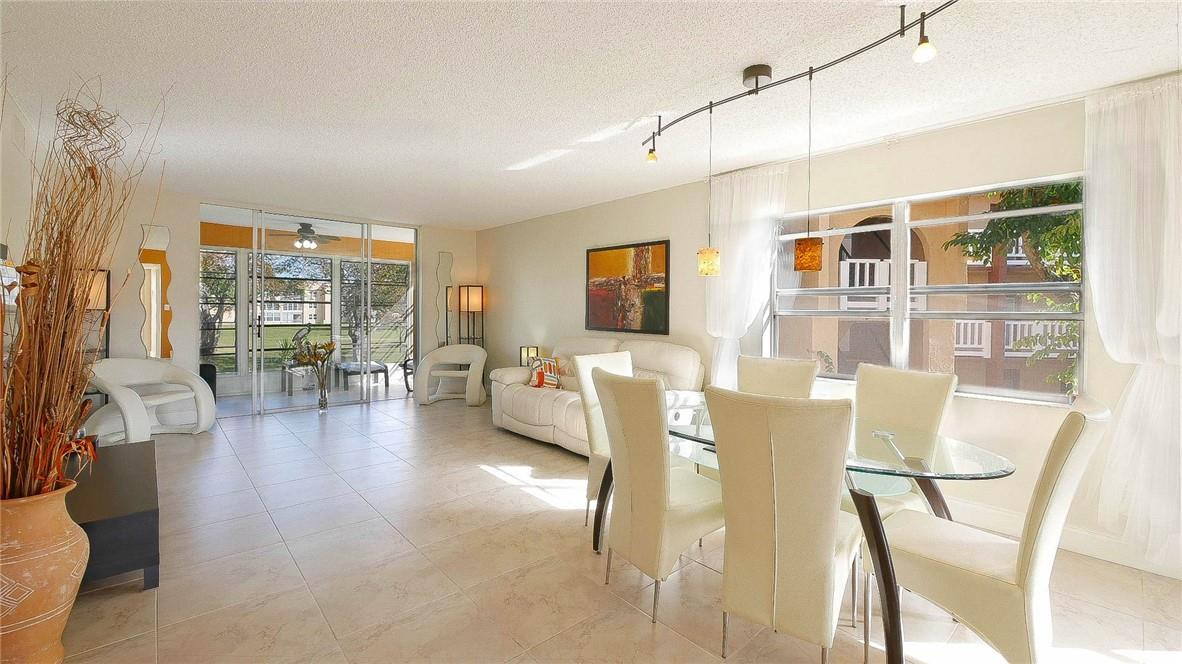 light & Bright corner unit!!  In Phase 3. Great views of golf course from enclosed terrace! Wide open Kitchen!  Neutral tiles throughout! Furnished with taste! master bathroom nicely remodeled!  Just bring your suitcase! What you see stays except two paintings and tv in master bedroom.  Amenities include Golf course, tennis courts, pickleball courts , shuffle board, cable, water, Gym, billiards, bingo, theater, jacuzzi, heated pool, sauna, ping pong, BBQ area, several cabanas and satellites with pool, comedy shows and more! Clubhouse is walking distance. Enjoy resort life! Association says $2,400 net income per month, no bankruptcies for 7 years, 10% down with cash offer, 25% down financing. 6 months maintenance in escrow. 680 credit. all on title must be 55+. Great place to live!!