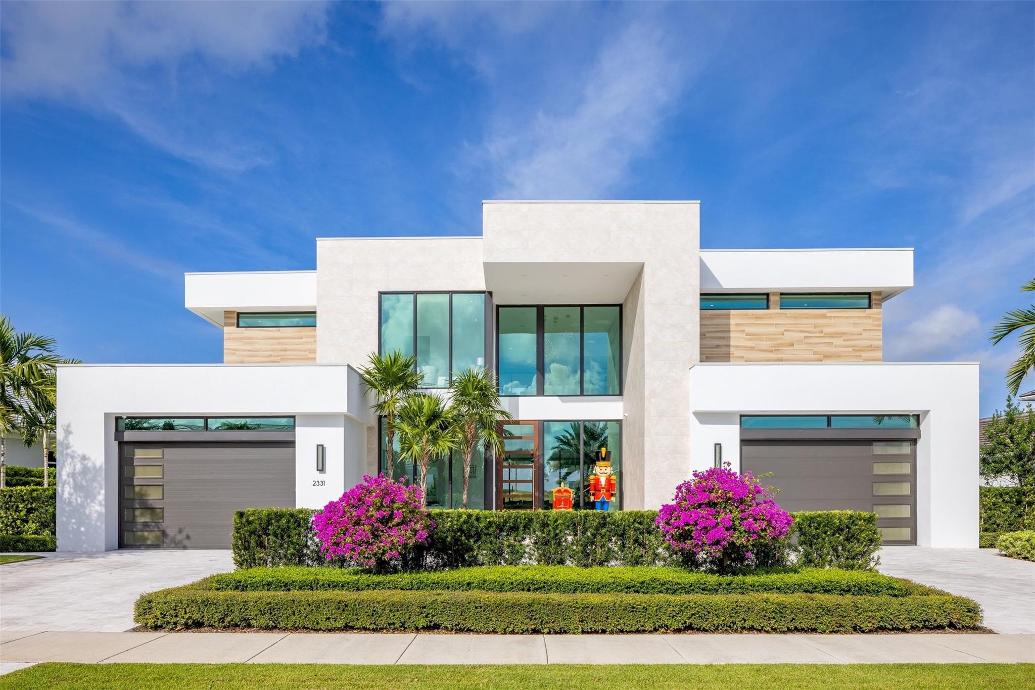 Welcome to the epitome of modern luxury living within the exclusive gated Enclave at Coral Ridge Country Club. The Enclave offers 24 hr manned security and ultimate privacy in a tranquil setting nestled along the ridge, where manicured rolling hills deliver emerald green views to all residents.  Volume ceilings, expansive windows & gourmet kitchen w/ top-of-the-line appliances, custom cabinetry, & an oversized island that beckons both cooking & socializing. The primary suite is a sanctuary of tranquility, w/spa-like bathroom & breakfast bar. 4 en-suite bedrooms; office; clubroom; & gym, under 7,200ACSF.  Enjoy outdoors w/a lavish pool/spa, outdoor kitchen, putting green & 1/2 basketball court. Close proximity to FLL Intl airport & FBO, pristine beaches and fine dinging restaurants! Designed by renowned architect Bruce Celinski & impeccably built by Keystone Homes, setting a new standard for opulence.
