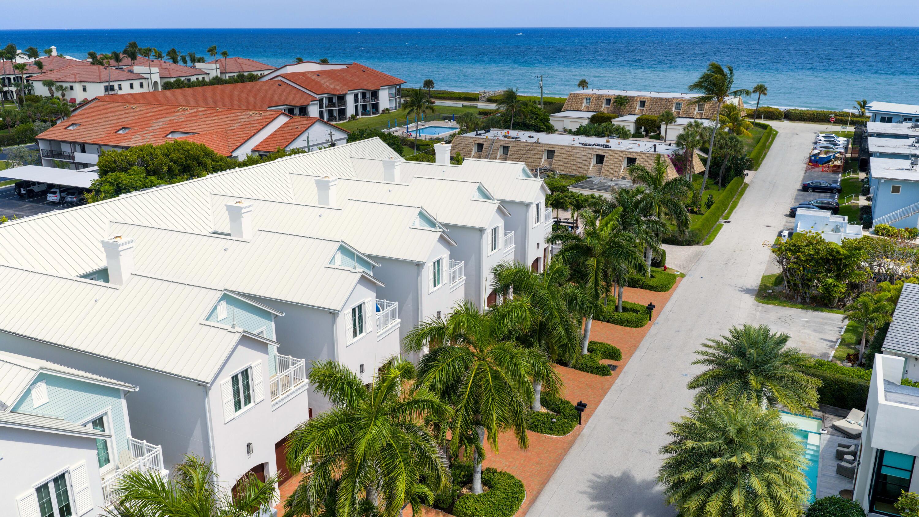 An exceptional coastal retreat in the heart of Ocean Ridge, this refined townhome delivers the rare combination of deeded beach access, ocean views, and designer finishes within an intimate seven-residence enclave. Thoughtfully designed for elevated seaside living, the home blends coastal contemporary architecture with resort-style outdoor spaces, including a private plunge pool and covered veranda, creating a true lock-and-leave luxury escape. 9 Adams Road, Ocean Ridge, Florida: One of the Gold Coast's best-kept secrets, Ocean Ridge is prized for its tranquility, relaxed ambiance, and unspoiled barrier island beauty nestled between the Atlantic Ocean and Intracoastal Waterway. Midway between Palm Beach and Boca Raton, Ocean Ridge is near a variety of boutique shops and gourmet restaurants as well as entertainment, cultural and sport venues, with the added convenience of Palm Beach International Airport a 20±-minute drive away.  PROPERTY:  A tropically landscaped courtyard fronts this elegant townhome, one of seven at exclusive Ocean Breeze, while in the walled backyard, the covered loggia flows out to the keystone-paved patio centered on a plunge pool with a waterfall fountain.  RESIDENCE:  Nestled in a prime location with exclusive deeded beach access, this exquisite coastal contemporary townhome offers the perfect blend of tranquility and luxury. The picturesque courtyard entry introduces the three-bedroom, 3 full and 1 half bathrooms, 3,939± square-foot residence, astutely designed around a light-filled open layout that accommodates a seamless flow for gracious entertaining. A highlight in the family room is a modern ribbon fireplace, while the living room features a beamed ceiling, built-in custom cabinetry and sliding doors that access the pool loggia. Just adjacent, the gourmet island kitchen, with a breakfast area, is finished with custom cabinetry, quartz countertops and professional-grade appliances that include a wine fridge. Upstairs, with a split bedroom plan for privacy, the luxurious primary suite is placed separately from the guest bedrooms. Curated decorator details throughout include volume ceilings, Italian wood-look porcelain tile flooring, handsome millwork and custom-fitted closets. Completing the overall floor plan are a half bath, laundry and two-car garage with a Tesla charging station. Amenities include natural-gas accommodation, impact windows and doors, metal roof, two new Carrier air-conditioners, central vac and automatic blinds.  DISCLAIMER: Information published or otherwise provided by the listing company and its representatives including but not limited to prices, measurements, square footages, lot sizes, calculations, statistics, and videos are deemed reliable but are not guaranteed and are subject to errors, omissions or changes without notice. All such information should be independently verified by any prospective purchaser or seller. Parties should perform their own due diligence to verify such information prior to a sale or listing. Listing company expressly disclaims any warranty or representation regarding such information. Prices published are either list price, sold price, and/or last asking price. The listing company participates in the Multiple Listing Service and IDX. The properties published as listed and sold are not necessarily exclusive to listing company and may be listed or have sold with other members of the Multiple Listing Service. Transactions where listing company represented both buyers and sellers are calculated as two sales. "No payments made until title passes" Some affiliations may not be applicable to certain geographic areas. If your property is currently listed with another broker, please disregard any solicitation for services. Information published or otherwise provided by seller, listing company or its representatives is deemed reliable but are not guaranteed and subject to errors, omissions, or changes without notice. Copyright 2024 by the listing company. All Rights Reserved.