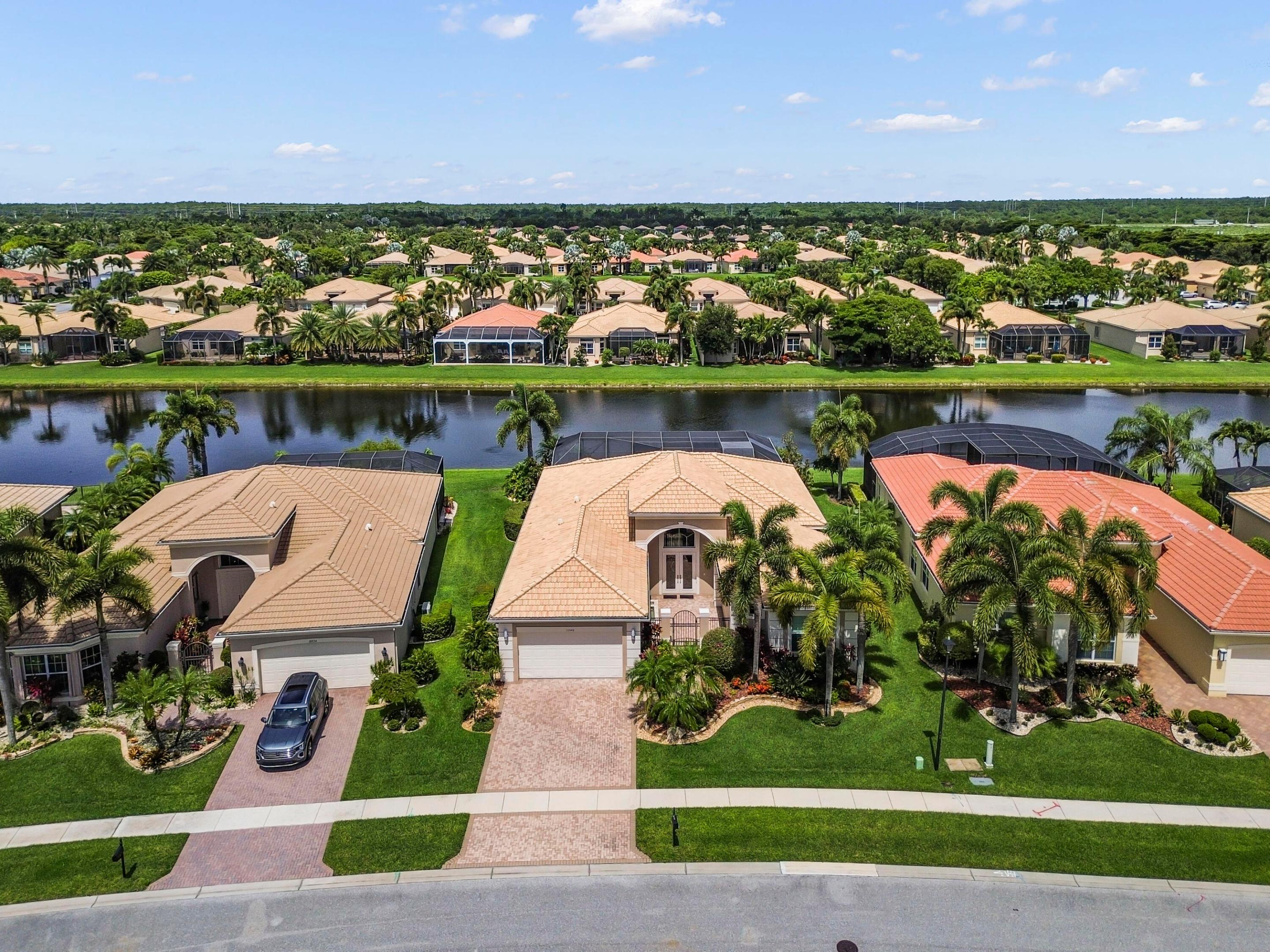 Welcome to this stunning 4-bedroom, 3-bathroom pool waterfront single-family home in the highly sought-after Lyons West area within the prestigious, gated Valencia Reserve 55+ community in Boynton Beach. This spacious single-story residence offers 2,838 square feet of thoughtfully designed living space with generous room proportions, comfortable layouts, and a two-car garage for added convenience.  This home has been lovingly maintained and upgraded throughout, featuring updated main living area flooring, hurricane protection, professional landscaping, custom window treatments, updated ceiling fans, and a well-maintained pool, all of which enhance both comfort and peace of mind. The kitchen boasts a newer refrigerator (2026), and the home is kept cool with an AC system replaced in 2020.  Perfectly positioned on a quiet interior street surrounded by picturesque lakes, this waterfront home offers peaceful views and a serene atmosphere. Enjoy being just moments from the community clubhouse and resort-style amenities, while also benefiting from convenient access to shopping, dining, major roadways, and everyday essentials. Experience the perfect blend of luxury, tranquility, and convenience in one of Boynton Beach's premier active adult communities in Lyons West.