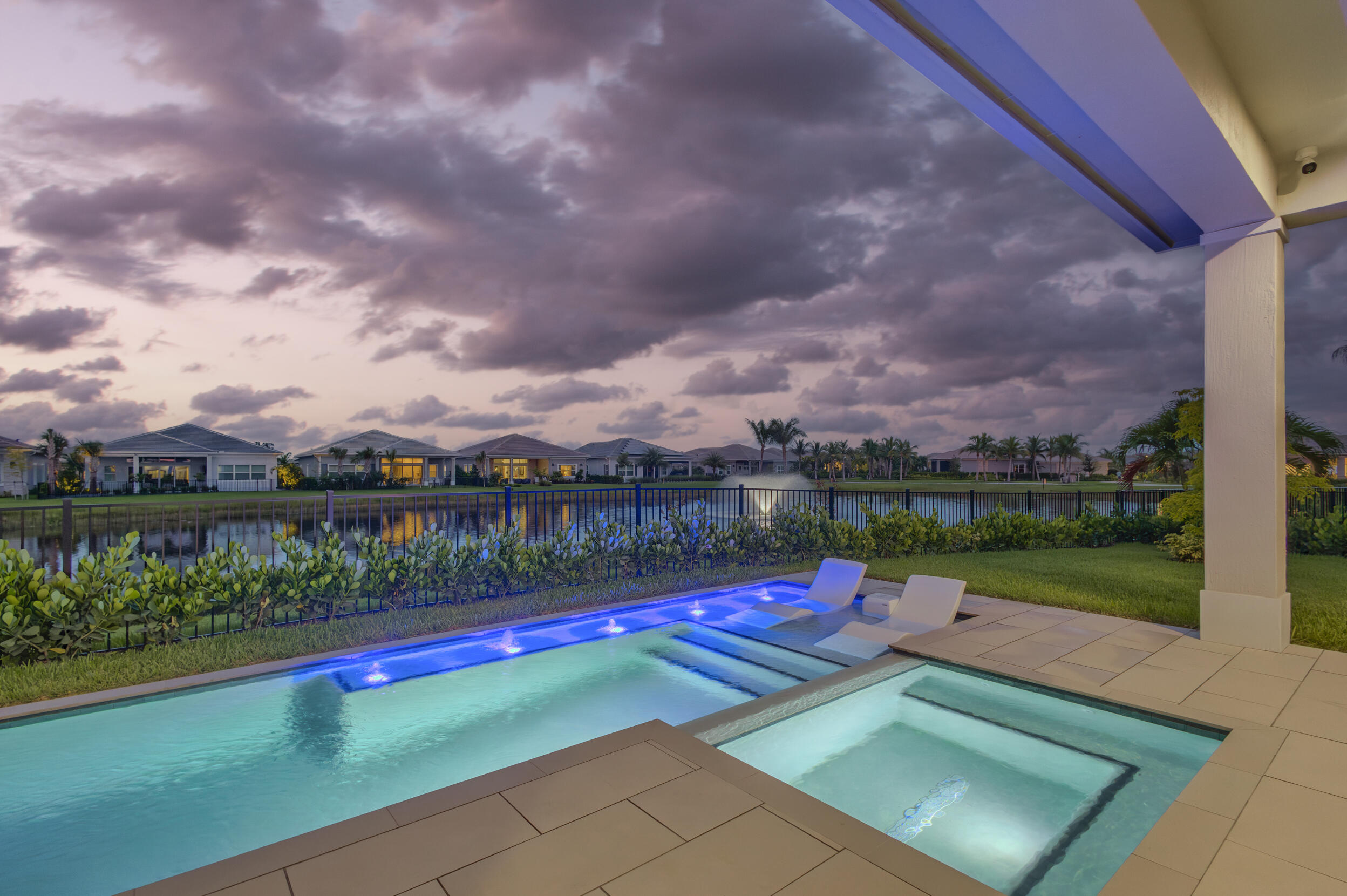 One of Regency at Avenir's standout Maya residences, offered designer furnished and positioned on one of the community's largest and widest lakefront lots. This highly sought-after Maya model delivers expansive backyard space, lake and fountain views, privacy, and resort-style outdoor living with a private pool, outdoor kitchen, and covered lanai. Thoughtfully finished with refined interiors and seamless indoor-outdoor flow. Enjoy The Pearl clubhouse, fitness center, resort pool, pickleball, tennis, bocce, basketball, walking paths, and Regency's premier 55+ lifestyle.