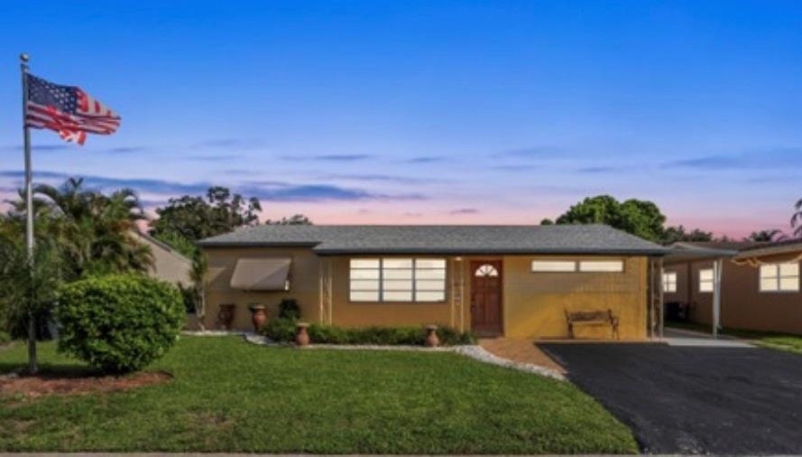 BACK ON MARKET-  Large single-story Hollywood/Pembroke Pines home with NO HOA, which is conveniently located close to Broward College! This 3 bedroom, 2 bedroom PLUS den/bonus room home with carport is priced to sell... House is larger than it appears as it includes the addition of a large master bedroom with a sitting area/walk-in closet, master bathroom with dual sinks, and large family room.  Features an open kitchen with an island that is great for entertaining.  Separate family room, bonus room or den, and dining room. Split bedroom plan. Covered/screened patio. Covered attached carport. Storage area with full-size washer/dryer.  Fully fenced yard with sprinklers.  Oversized driveway, room to park your boat.   Walk to nearby college, restaurants, and shopping!