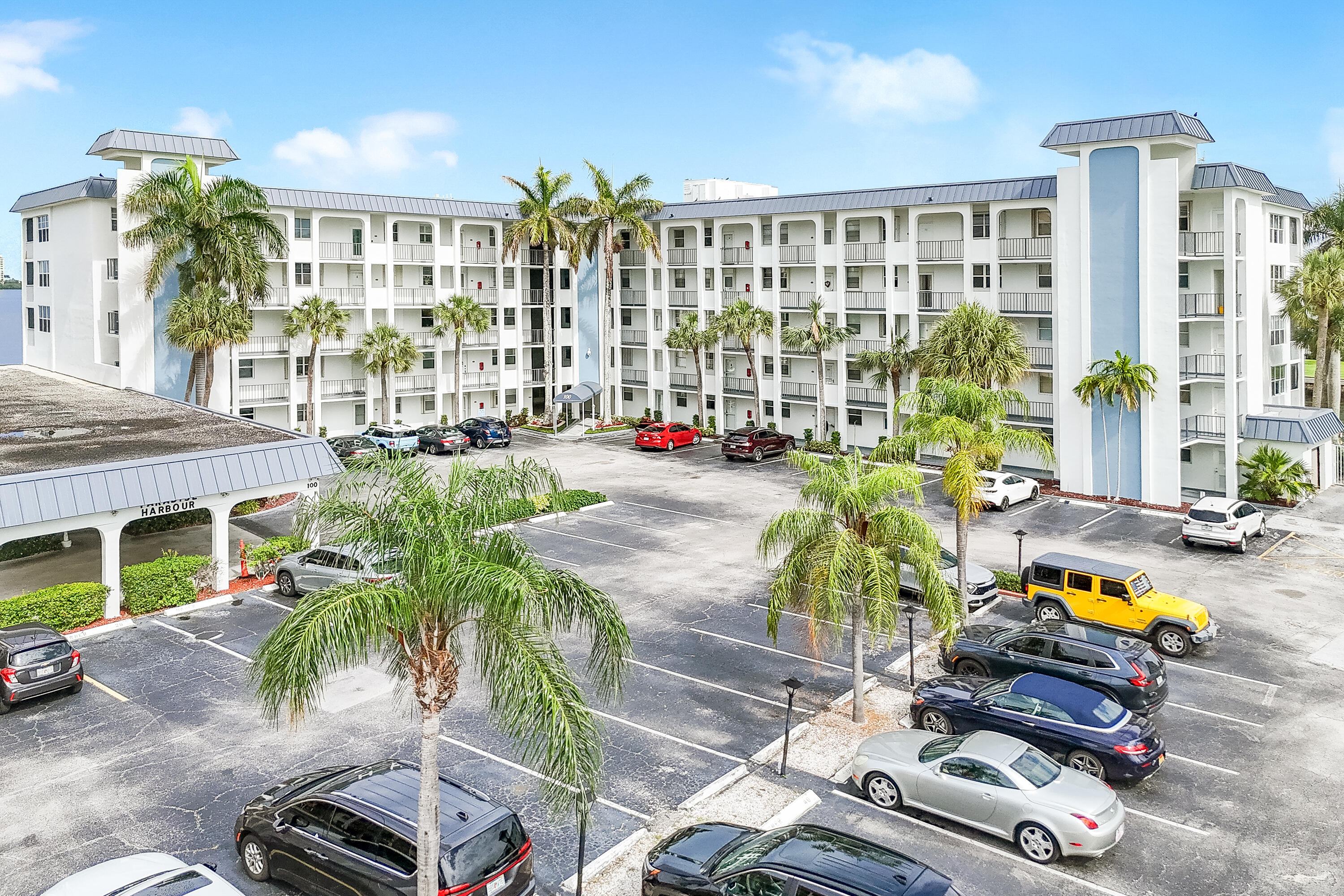 Wake up to panoramic water views from this beautifully positioned waterfront residence in Paradise Harbour. Overlooking the Earman River and Intracoastal Waterway, this spacious 2BR/2BA condo offers an ideal blend of coastal charm and everyday comfort. Relax on the screened balcony while enjoying passing boats and breathtaking sunsets. The well-designed floor plan features expansive living areas, generous bedrooms, and seamless indoor-outdoor living. Paradise Harbour offers resort-style amenities including a waterfront pool, fitness center, elevator access, and a prime North Palm Beach location just minutes from beaches, marinas, golf courses, fine dining, and upscale shopping. Experience the best of the South Florida waterfront lifestyle. Extensively remodeled in 2023 including kitchen  and bathrooms. Assigned parking very close to your unit.