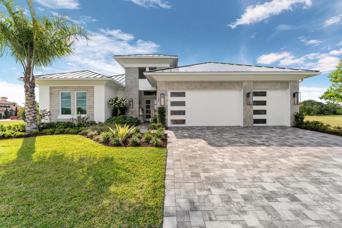 Tesoro Club, one of Florida's most prestigious private golf communities, sets the stage for refined luxury in this exceptional Ecclestone Signature model home. Offering three bedrooms plus a versatile den, the residence captures sweeping golf course and water views with premium upgrades and designer finishes throughout. The Coastal Modern open layout features soaring ceilings, abundant natural light, and seamless indoor-outdoor living. An expansive covered patio with a custom TV wall creates the perfect setting for elevated entertaining. Impact glass and impeccably curated interiors by a renowned South Florida designer complete this sophisticated, move-in ready retreat.