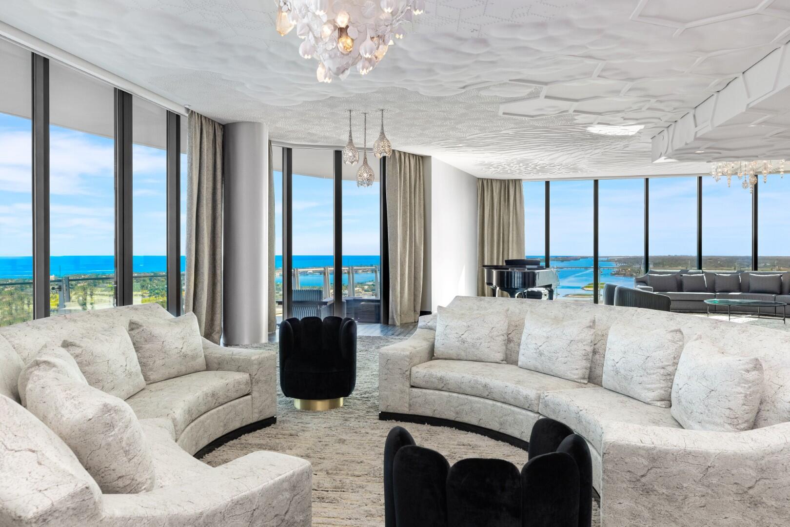 A Breathtaking Estate in the Sky - This extraordinary penthouse condominium spans nearly 20,000+/- total square feet and offers an unparalleled level of luxury, privacy, and scale. With five spacious bedrooms, five bathrooms, and four powder rooms and a spectacular wraparound terrace offering 360-degree panoramic views of the Intracoastal Waterway, the Atlantic Ocean, Palm Beach Island, the yachts at the Palm Beach Marina, and the Downtown West Palm Beach skyline. Every principal room is positioned to capture breathtaking vistas from sunrise to sunset. In addition to the magnificent views, the condominium also boasts expansive wall space perfect for art collections. The impressive living spaces are thoughtfully designed for both formal entertaining and serene everyday living.

The dramatic foyer opens to an expansive waterfront living room with sweeping views and gorgeous David Wiseman ceiling installation. Generously scaled family room with wet bar, Ingrid Donat wall cabinet finished in her signature style, and spectacular Lindsey Adelman light fixture. Stunning library with floor-to-ceiling bookshelves lining the walls.

Gourmet custom chef's kitchen with an oversized island, abundant storage, walk-in refrigerator, and top-of-the-line appliances including gas range and Sub-Zero refrigerator and freezer. The kitchen is accompanied by a large butler's pantry with additional full-size appliances that connects to the stunning formal dining room, ensuring seamless entertaining at any scale.

The primary wing serves as a private retreat, complete with a hair salon, massage room, office with built-ins, and an oversized walk-in closet in addition to a large dressing area. Second oversized walk-in closet located in the primary vestibule allowing for abundant storage. Expansive primary bedroom with Fromental and LaLique glass wallcoverings. Stunning primary bathroom with LaLique fixtures and paneling in the cabinetry, walls, and doors.

Additional highlights include a rare, personal 2-car garage along with extra space in the main garage, two main elevators, and two service elevators. The convenient staff corridor includes in-unit laundry room, security room, an office, powder room, and a large staff lounge.

This one-of-a-kind, iconic penthouse represents the pinnacle of waterfront luxury.

The Bristol Condominium, one of the most sought-after buildings in Downtown West Palm Beach, features exceptional amenities including a beauty salon, fitness center overlooking the Intracoastal, two spas, pool and jacuzzi, entertainment terrace, lounge, valet, concierge, and more.