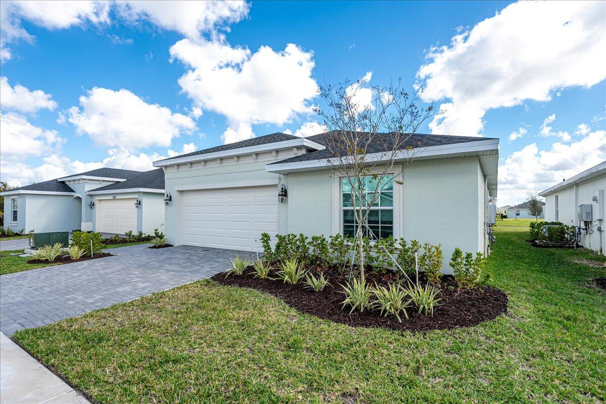 This stunning 4-bedroom, 2-bath home offers an open-concept layout, seamlessly connecting the kitchen, dining, and living areas. The owner's suite is ideally located in the back corner of the home with an en-suite bathroom. Ready-to-use patio overlooking the lake. The home includes a convenient two-bay garage, stainless steel appliances, a GAR RANGE, quartz countertops, upgraded light fixtures and a Ring doorbell system. *Located in a soon to be gated community with a beautiful clubhouse, fitness center, community pool, pickleball courts, playground, and more! Hurry and make this house your beloved family home!